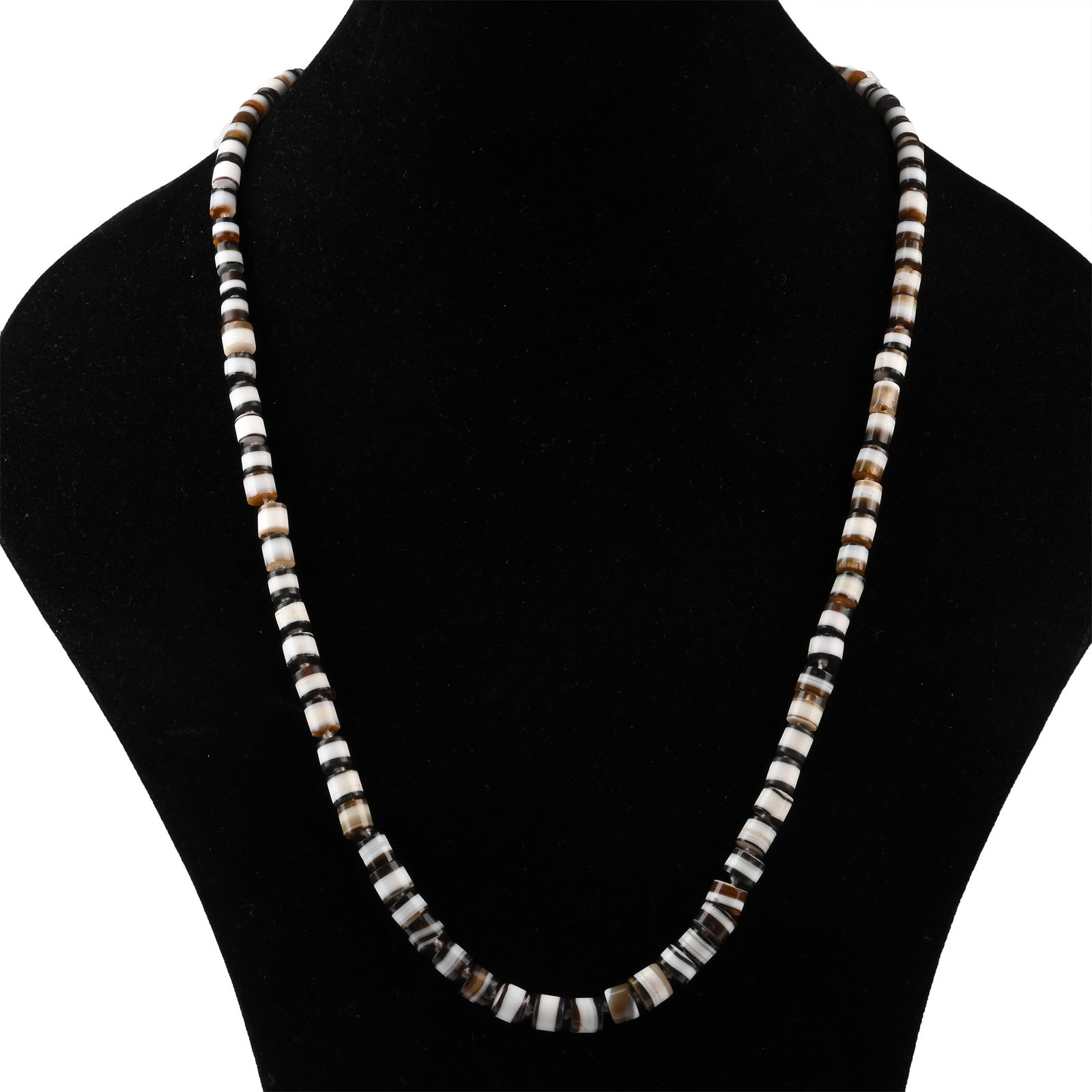 Bactrian Banded Agate Bead Necklace: 1st millennium B.C. Composed of cylindrical beads showing contrasting banding, restrung with a modern clasp. 52.4 grams, 73 cm (28 3/4 in.). London, UK gallery, 1971-early 2000s. Private collection, L