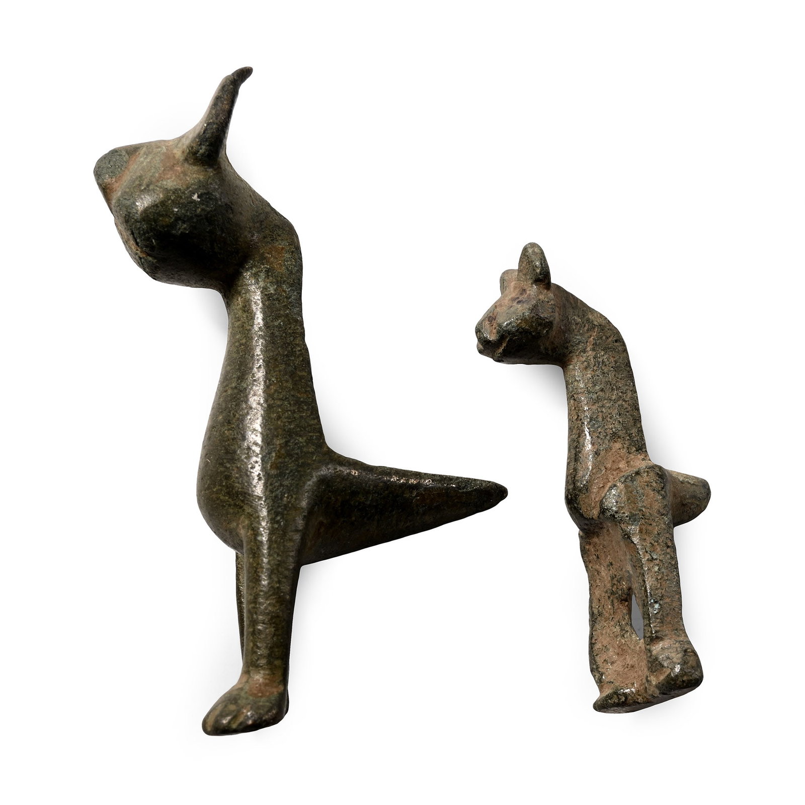 Western Asiatic Bronze Cat Protome Group: Circa 11th century A.D. Each formed as a finial with tall extended neck and sleek feline head, scooped triangular lug to reverse. 47.6 grams total, 44-58 mm (1 3/4 - 2 1/4 in.). [2] From a UK collecti