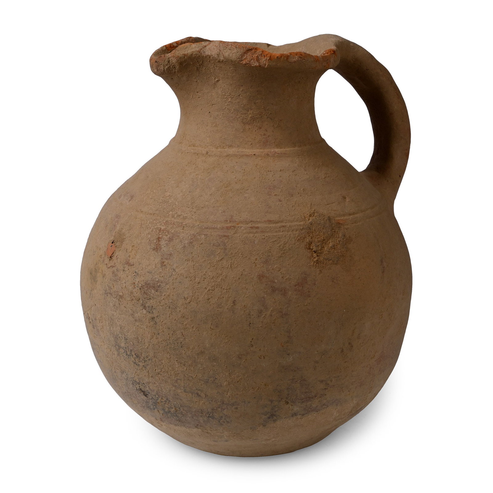 Western Asiatic Terracotta Jug with Trefoil Mouth: 1st millennium B.C. Bulbous body with flattened base and trefoil mouth, strap handle to the rear and incised circumferential bands on the shoulder. 1.6 kg, 22.4 cm (8 7/8 in.). Ex Abelita collection, 