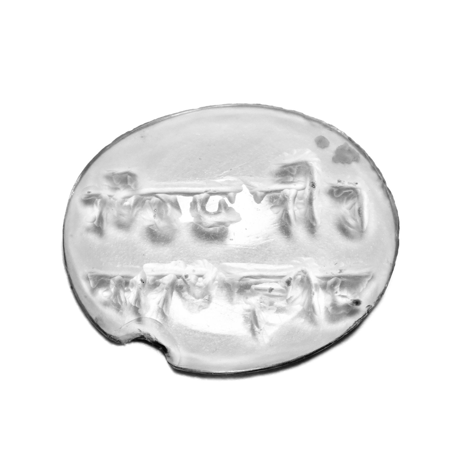 Western Asiatic Rock Crystal Gemstone with Calligraphic Text: Seljuk period, 12th-13th century A.D. Ellipsoid type with incuse design of two lines of Naskh text; supplied with a museum-quality impression. 0.44 grams, 13 mm (1/2 in.). [No Reserve] From the privat