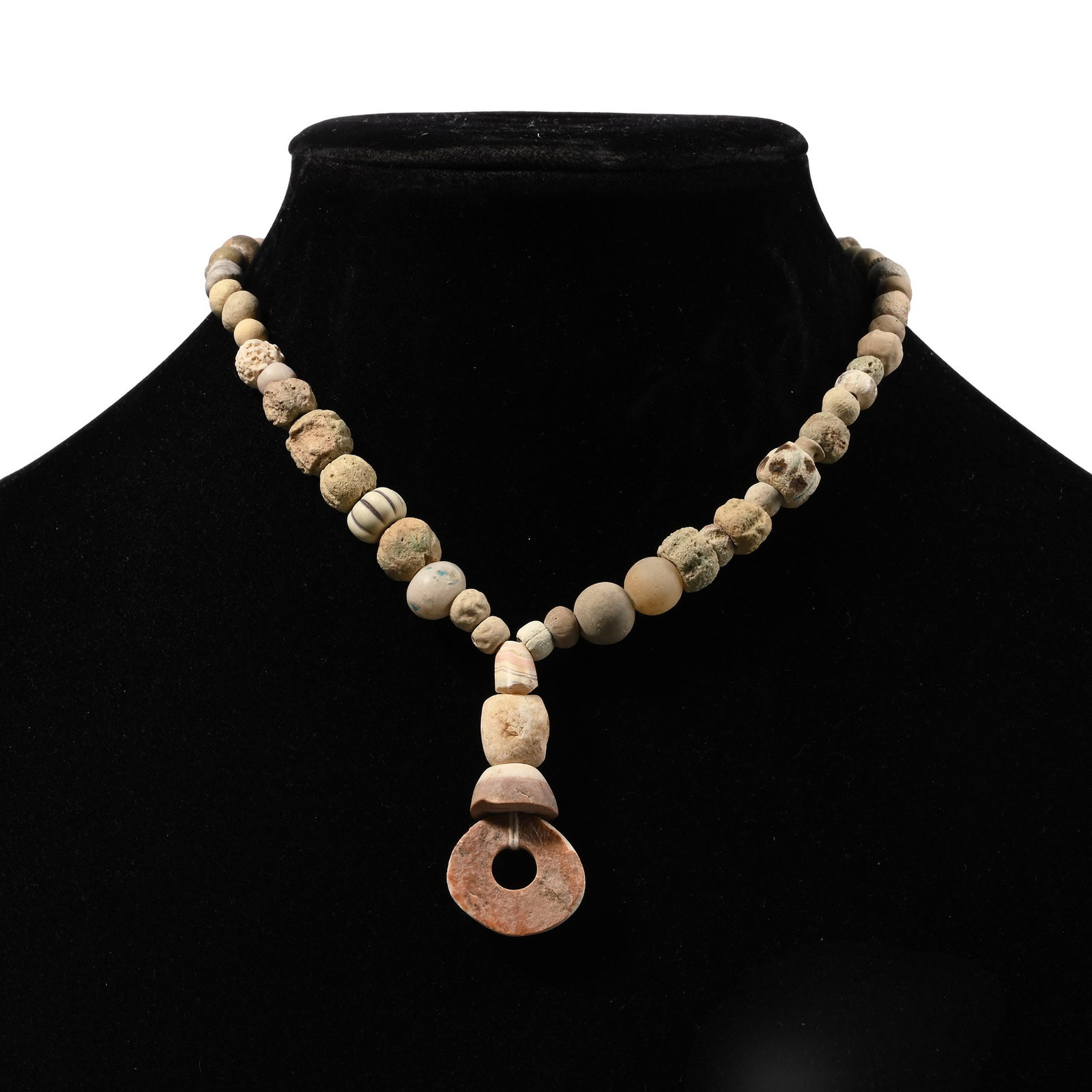 Western Asiatic Terracotta and Other Bead Necklace String: 1st millennium B.C. and later. Composed mainly of melon, oblate and spherical beads, with a large annular bead as a central feature, restrung. 31 grams, 33 cm (13 in.). [No Reserve] Ex Ancient Art Sho
