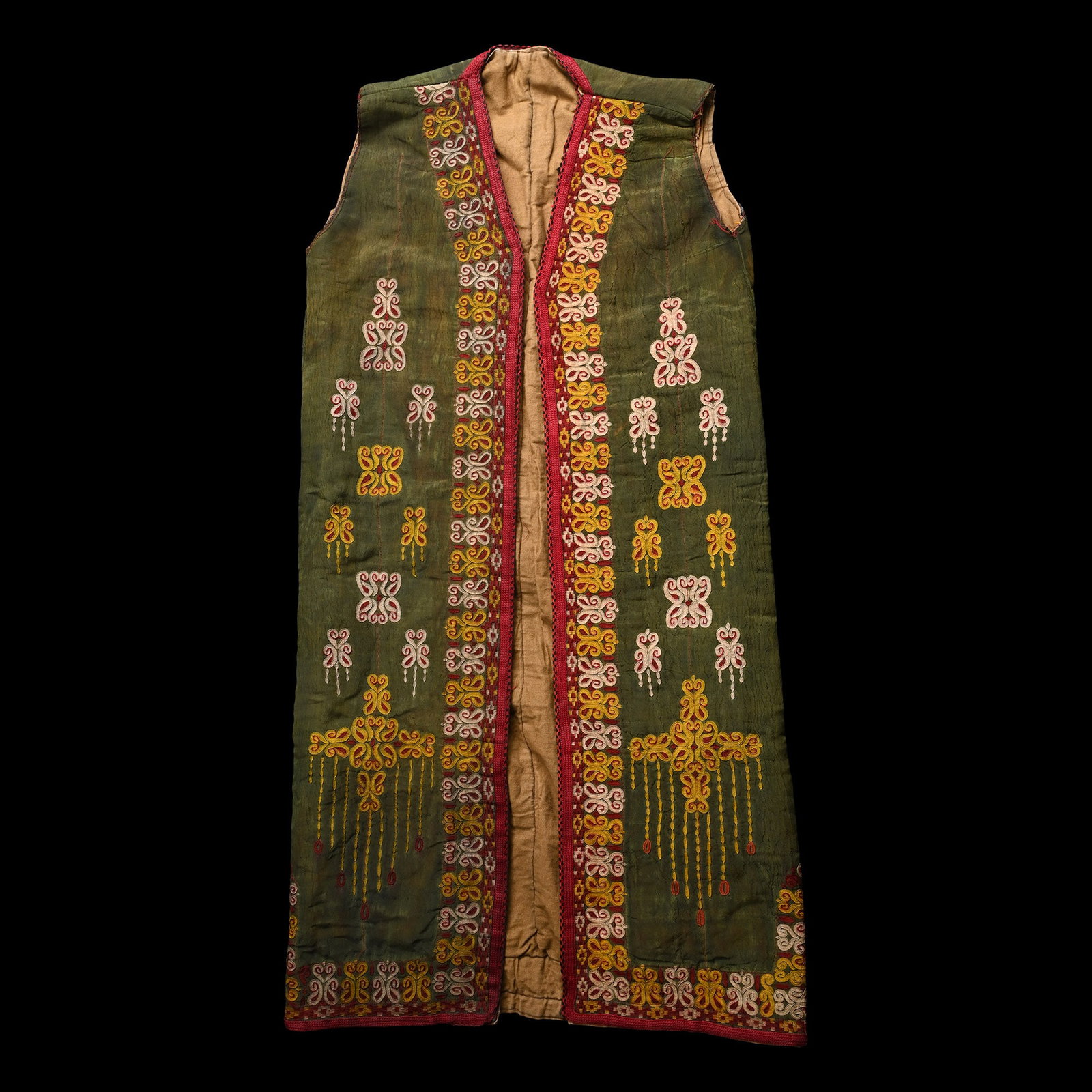 Uzbek Double-Sided Pringi Tunic: 20th century A.D. Reversible type in olive green with bands of floral and geometric embroidered designs, and plain brown cloth. Cf. Mohamed, N., ?The Traditional Style of women?s clothing in Uzbekista