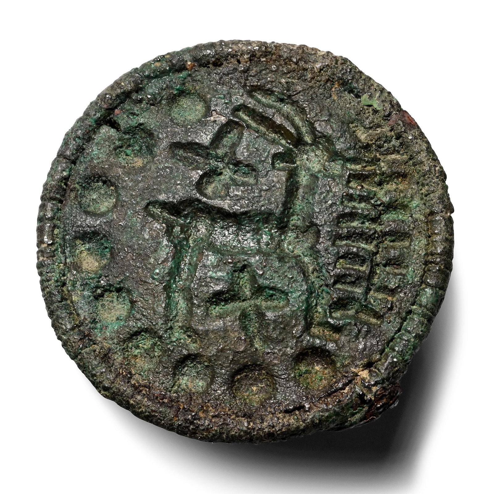 Bactrian Bronze Zoomorphic Stamp Seal: 2nd-1st millennium B.C. Discoid seal with a small loop on the reverse, underside with a horned quadruped standing right, a tall slender tree before the animal and an X-motif above and below. 5.02 gram