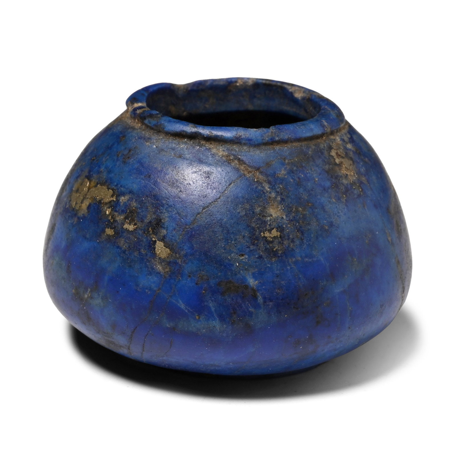 Western Asiatic Lapis Lazuli Cosmetic Vessel: 2nd millennium B.C. Conical body tapering towards a narrow mouth with a raised rim, low foot. 37.1 grams, 37 mm (1 1/2 in.). UK private collection, acquired on the UK art market. TimeLine Auctions fol
