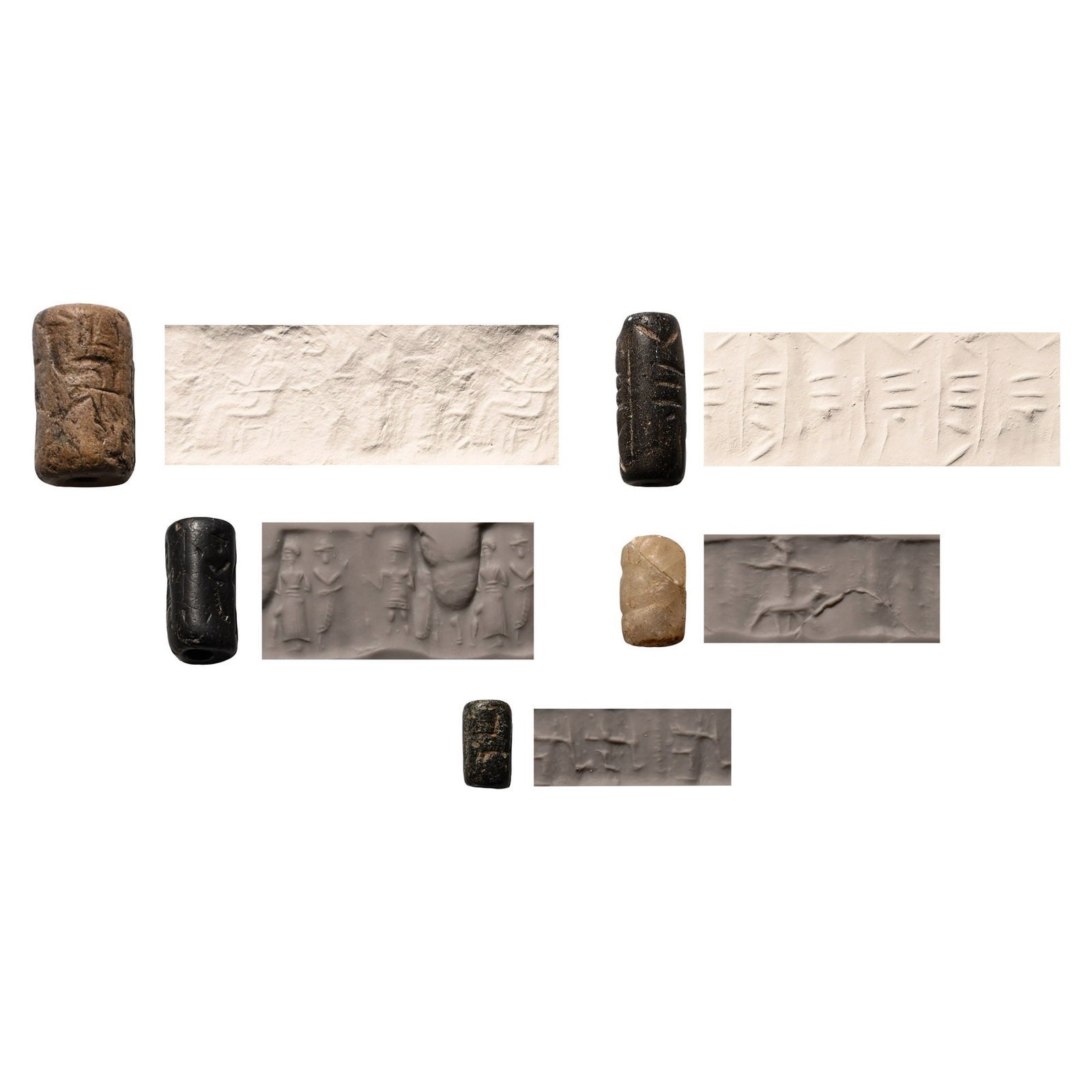 Western Asiatic Stone Cylinder Seal Group: 2nd-1st millennium B.C. Comprising: a dark grey steatite seal with two standing creatures with two smaller creatures above them; a hematite seal with a Syrian man wearing a short skirt, a man with cur