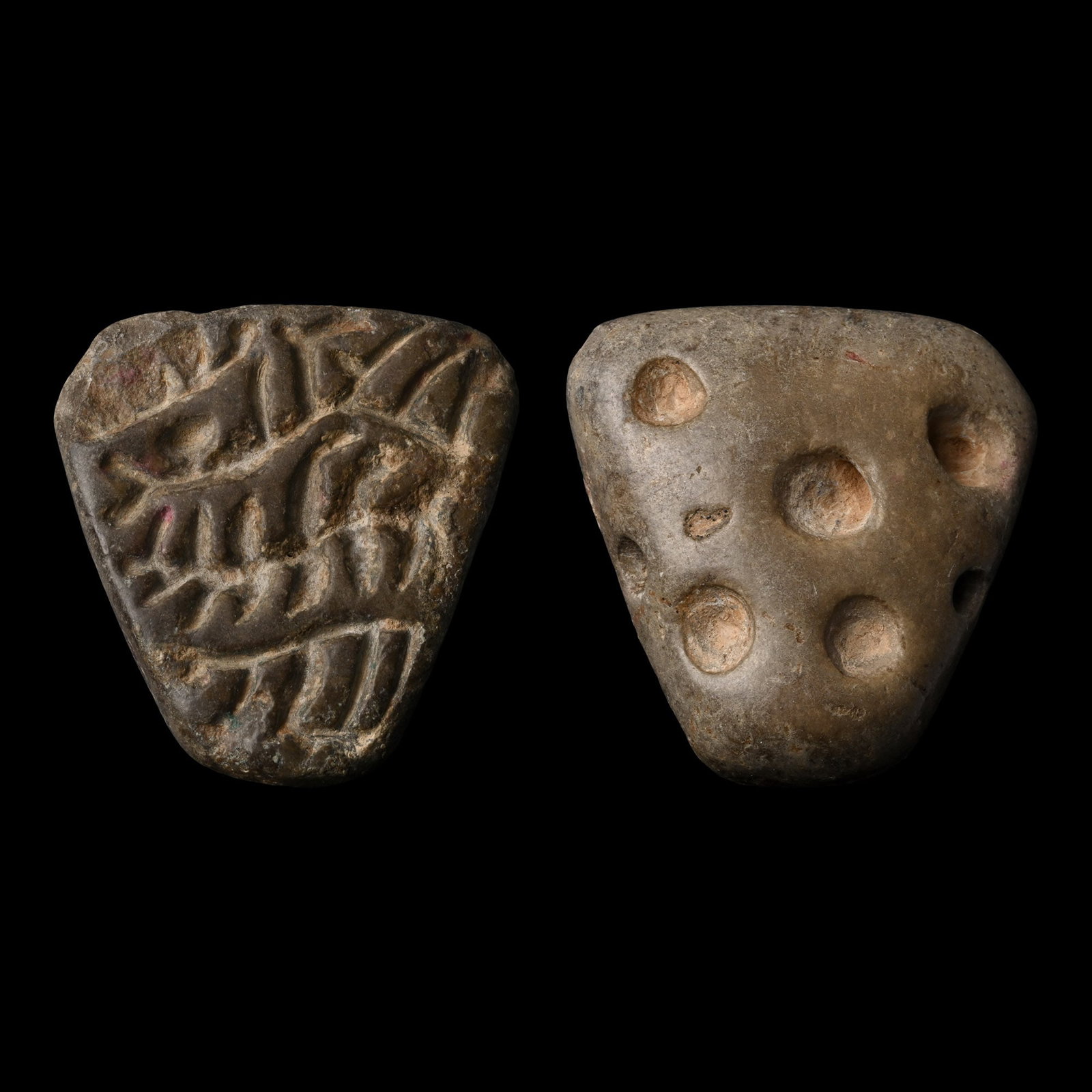 Western Asiatic Stone Seal with Engraved Design: 4th-3rd millennium B.C. Triangular in plan and plano-convex in section with drilled upper face, geometric design to underside. Cf. seal in similar style from Northern Mesopotamia or Iran, Late Uruk/Je