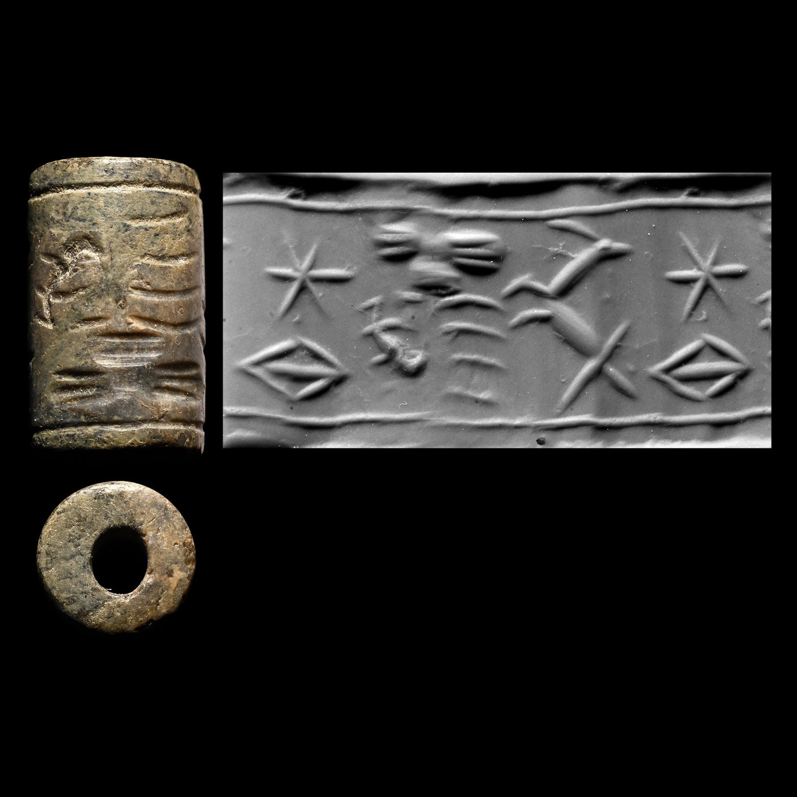 Syrian Steatite Cylinder Seal: Circa 1300 B.C. A small cylinder seal showing a beast looking back, a winged sun and a flying duck, star and eye motifs as fillers; supplied with a museum-quality impression. Cf. parallel for the beas