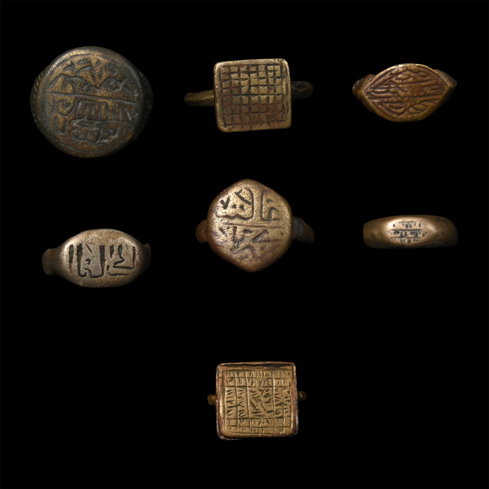 Western Asiatic Bronze Ring Collection: Circa 16th-18th century A.D. Comprising seven rings, each with a decorative bezel, one fragmentary. 43.3 grams total, 18-27 mm (3/4 - 1 in.). [7, No Reserve] Acquired in the late 1980s-early 1990s. Pr