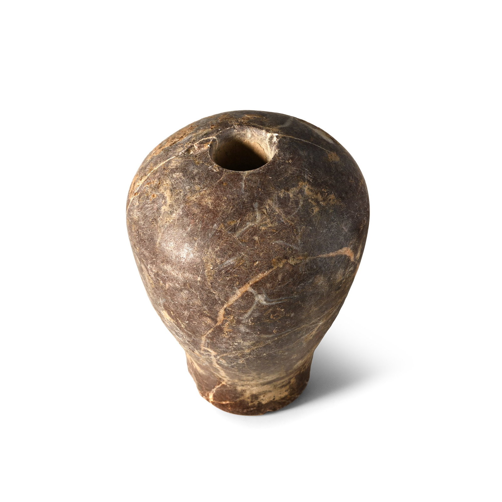 Western Asiatic Polished Stone Macehead: 3rd-2nd millennium B.C. With a globular body and a short cylindrical socket. 335 grams, 78 mm (3 in.). From the collection of a London, UK, gentleman, 1990s. TimeLine Auctions follows a rigorous vetti