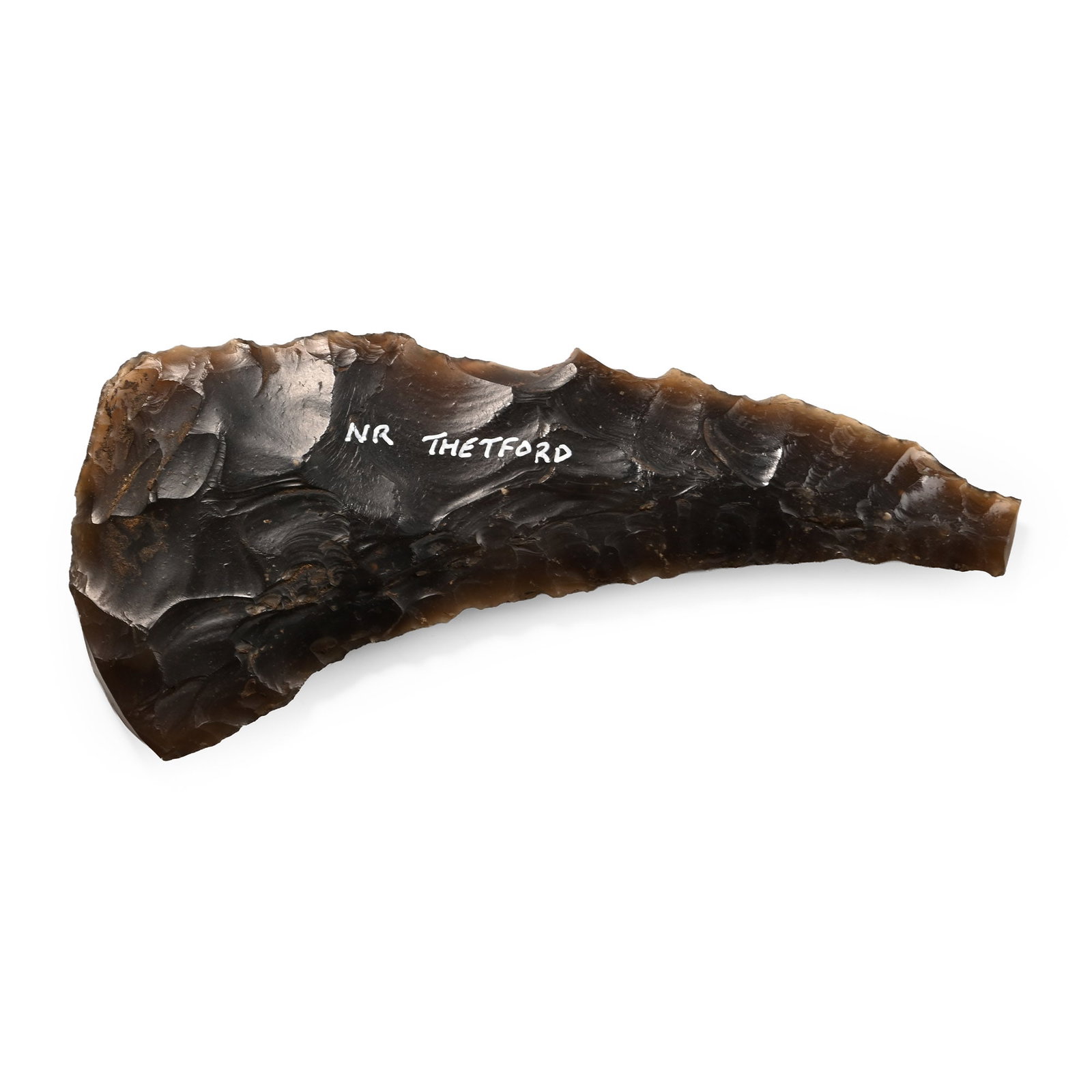 British Stone Age Knapped Flint Sickle Knife: Neolithic Period, circa 6,000 B.P. Curved body with some serrations on the upper edge, inked collector's note 'Nr Thetford' on one side. 71 grams, 13.9 cm (5 1/2 in.). [No Reserve] Found near Thetford