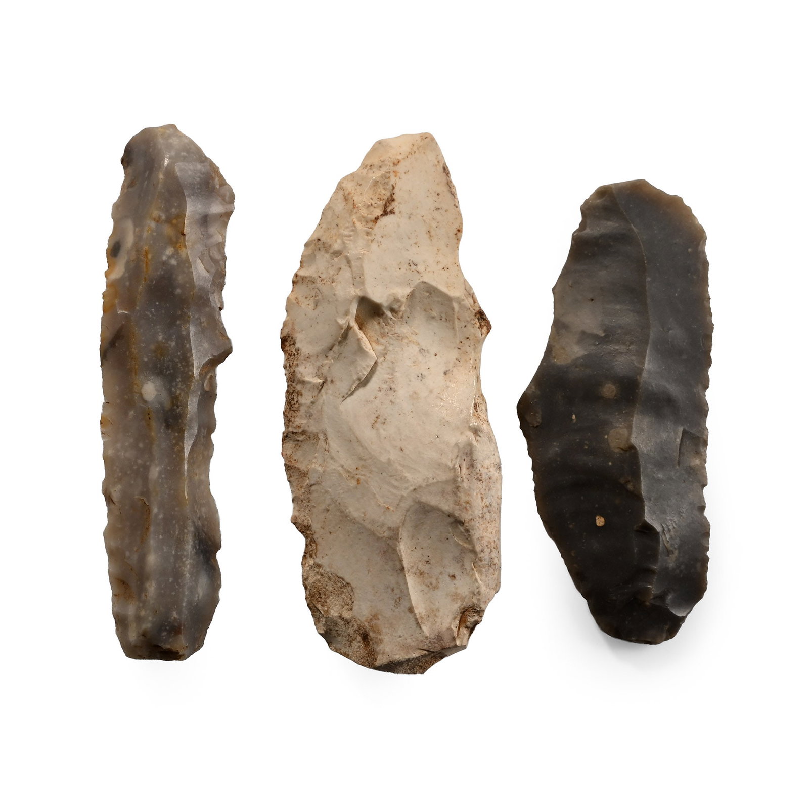 British Stone Age Knapped Flint Blade Collection: Neolithic Period, circa 6,000 B.P. Comprising three knapped blades, each with a find location. 23 grams total, 50-58 mm (2 - 2 1/4 in.). [3, No Reserve] Found Bradon, Cavesham, and Coteshill, Suffolk,