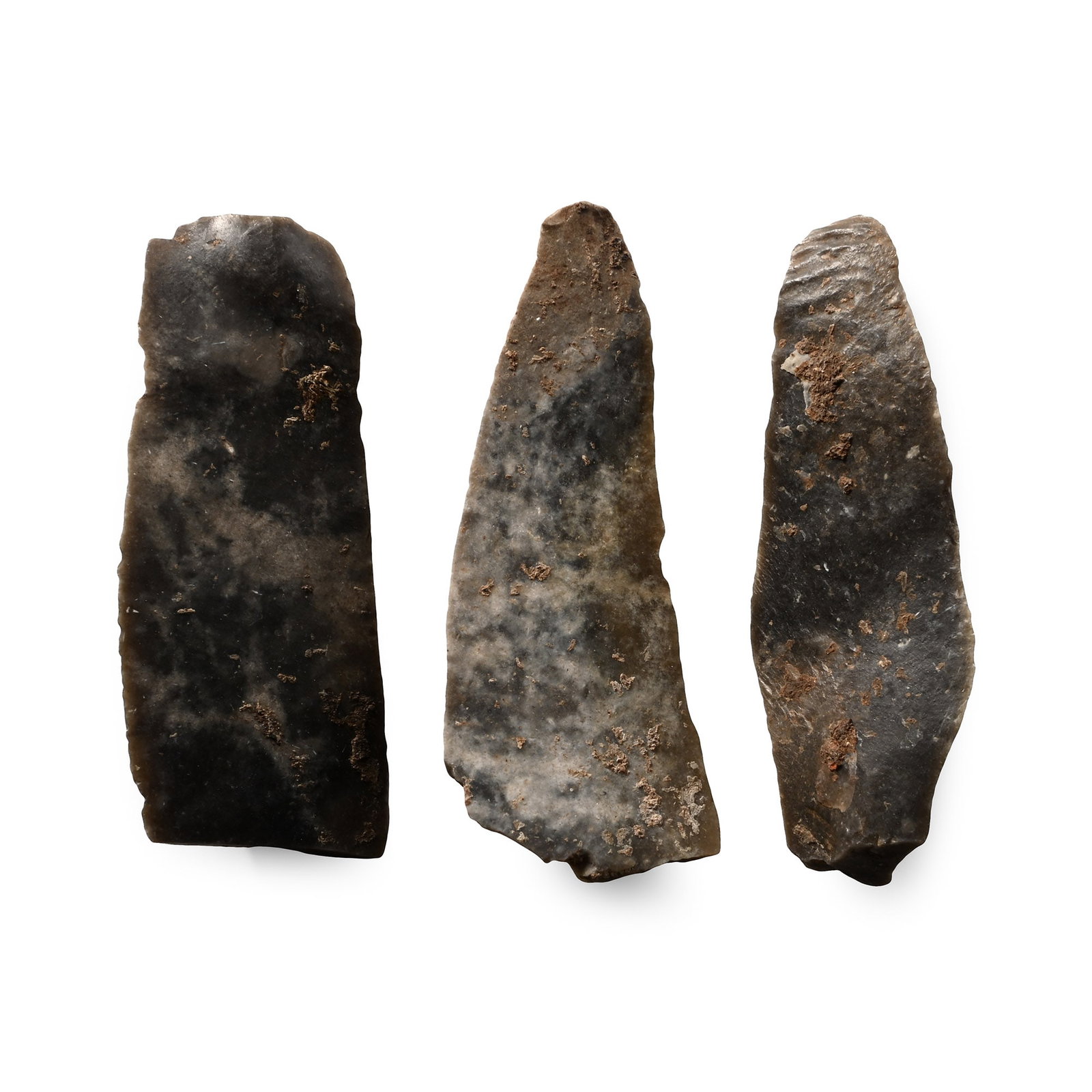 French Stone Age Solutrean Knapped Flint Blade Group - Ex Sir Arthur Evans: Upper Palaeolithic Period, 22,000-17,000 B.P. Comprising two blades made from bluish-white flint, and one made of dark blue-grey flint. 18.3 grams total, 48-52 mm (1 7/8 - 2 in.). [3, No Reserve] Foun