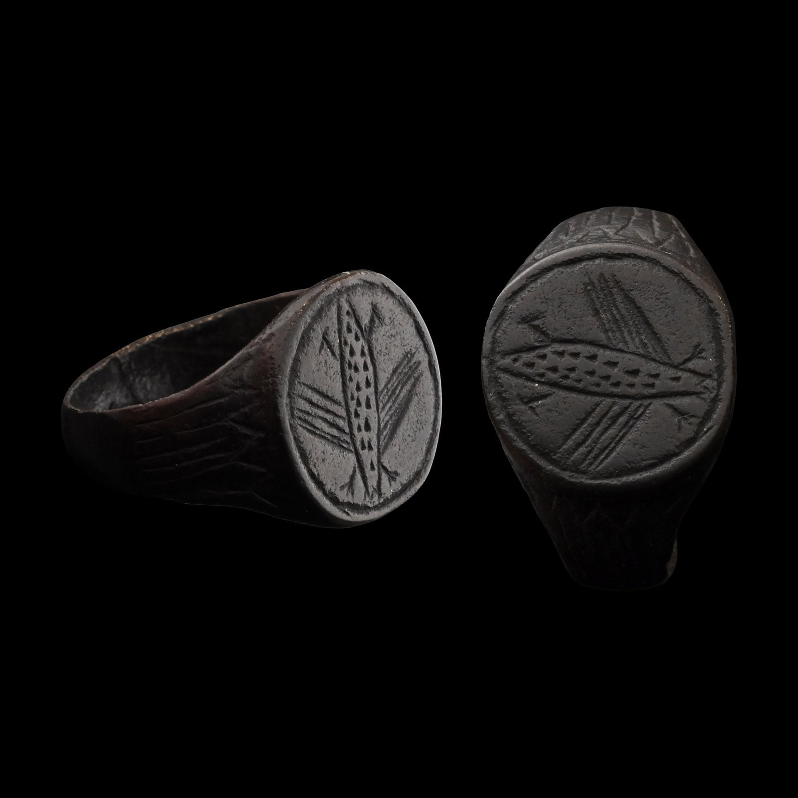 Migration Period Bronze Ring with Insect: Circa 6th-8th century A.D. With arcading to the shoulders, discoid bezel with incised winged insect motif. 5.13 grams, 19.55 mm overall, 17.90 mm internal diameter (approximate size British L 1/2, USA