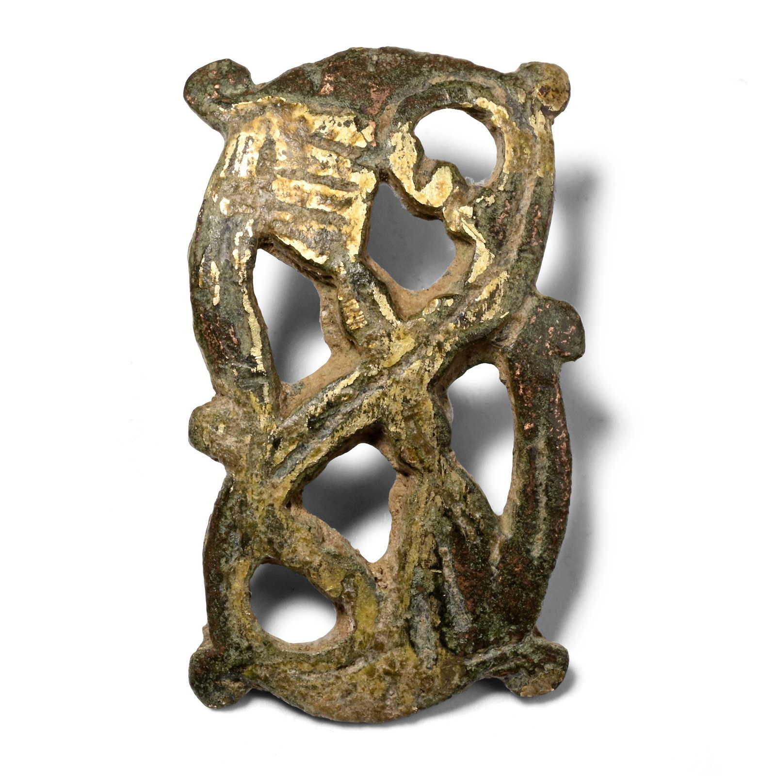 Late Anglo-Saxon Gilt Bronze Mount: Circa 10th-11th century A.D. With curved profile, openwork design in Winchester Style, attachment lug to reverse. 6.47 grams, 30 mm (1 1/8 in.). [No Reserve] From the private collection of the late co