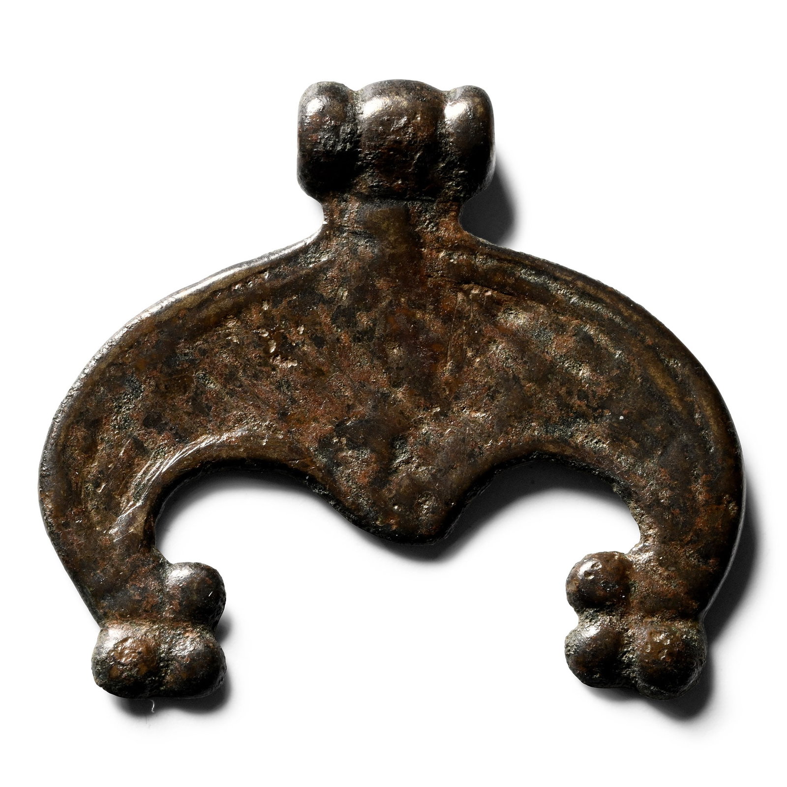 Viking Period Bronze Lunar Pendant: Circa 9th-11th century A.D. Crescentic body with ribbed suspension loop and pelletted terminals. 6.58 grams, 36 mm (1 3/8 in.). [No Reserve] Ex German art market, 2000s. Acquired from an EU collector 