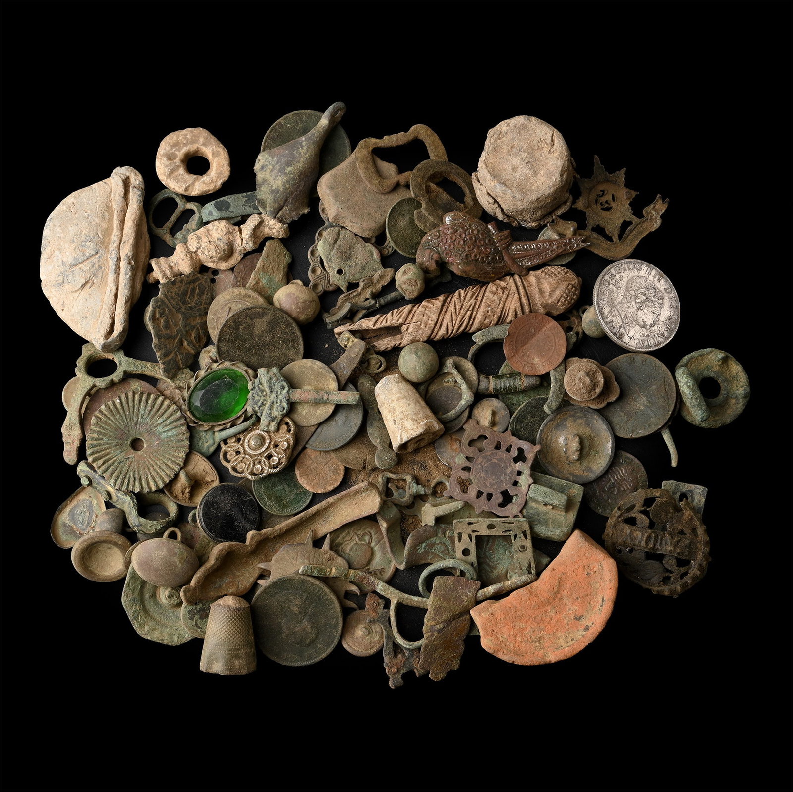 Medieval to Post Medieval Bronze and Other Artefact Group: 12th-20th century A.D. Large group of mixed artefacts, including clothes fasteners, mounts, brooches, buckles, coins, and others. 755 grams total, 11-83 mm (3/8 - 3 1/4 in.). [No Reserve] Found Suffol
