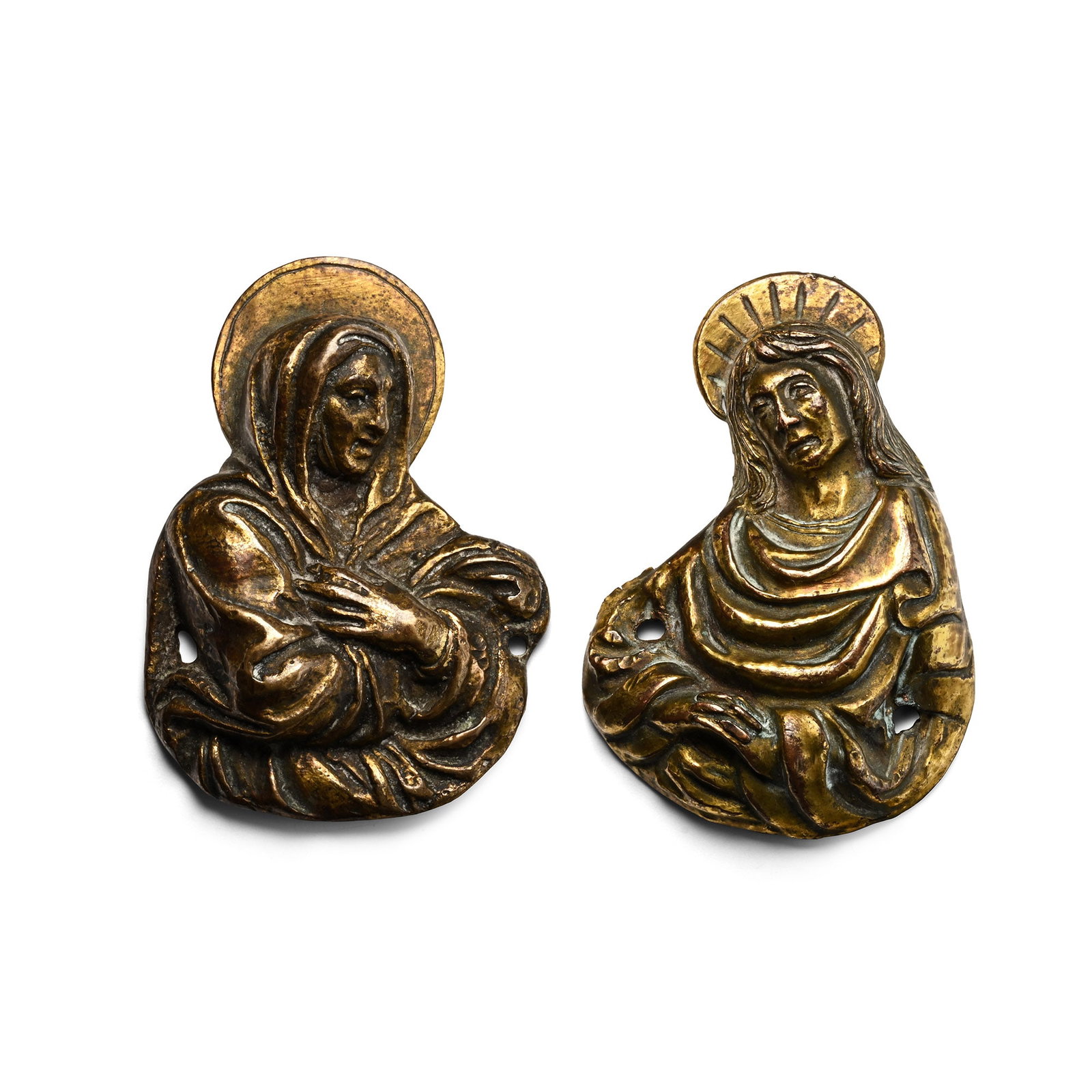 Post Medieval Gilt Bronze Plaques of Mary Magdalene and Saint John the Evangelist: Italy, 16th century A.D. Comprising: a nimbate figure of Mary, dressed in voluminous robes, arms crossed at the chest and pierced through the edges; a nimble figure of John wearing voluminous robes, g