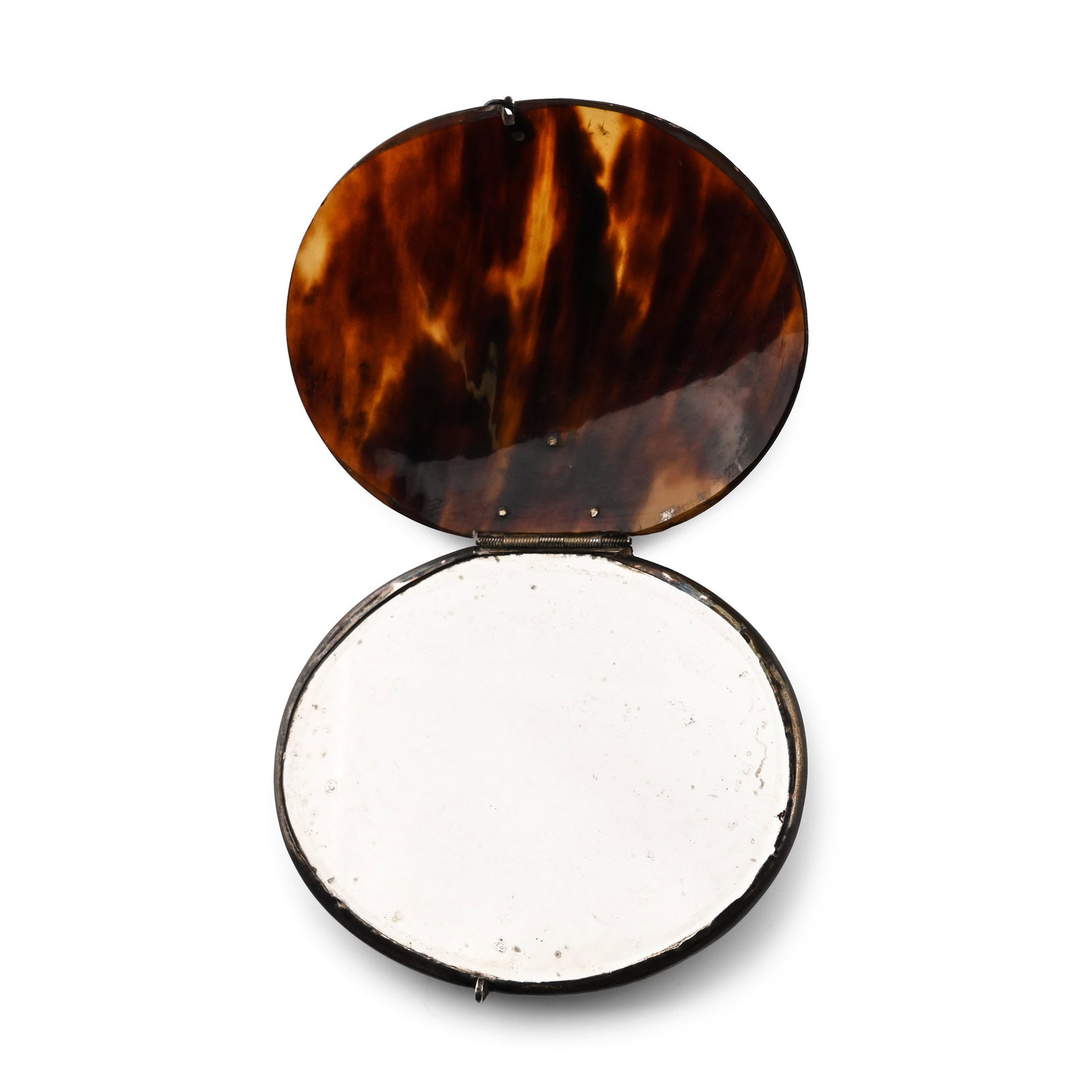 Silver-Mounted Shell Travelling Mirror: Dutch Colonies, 17th century A.D. Discoid mirror set in a silver frame and a polished shell case, secured with a silver flower-and-scroll mount and a small hook. 56.2 grams, 86 mm (3 3/8 in.). Private
