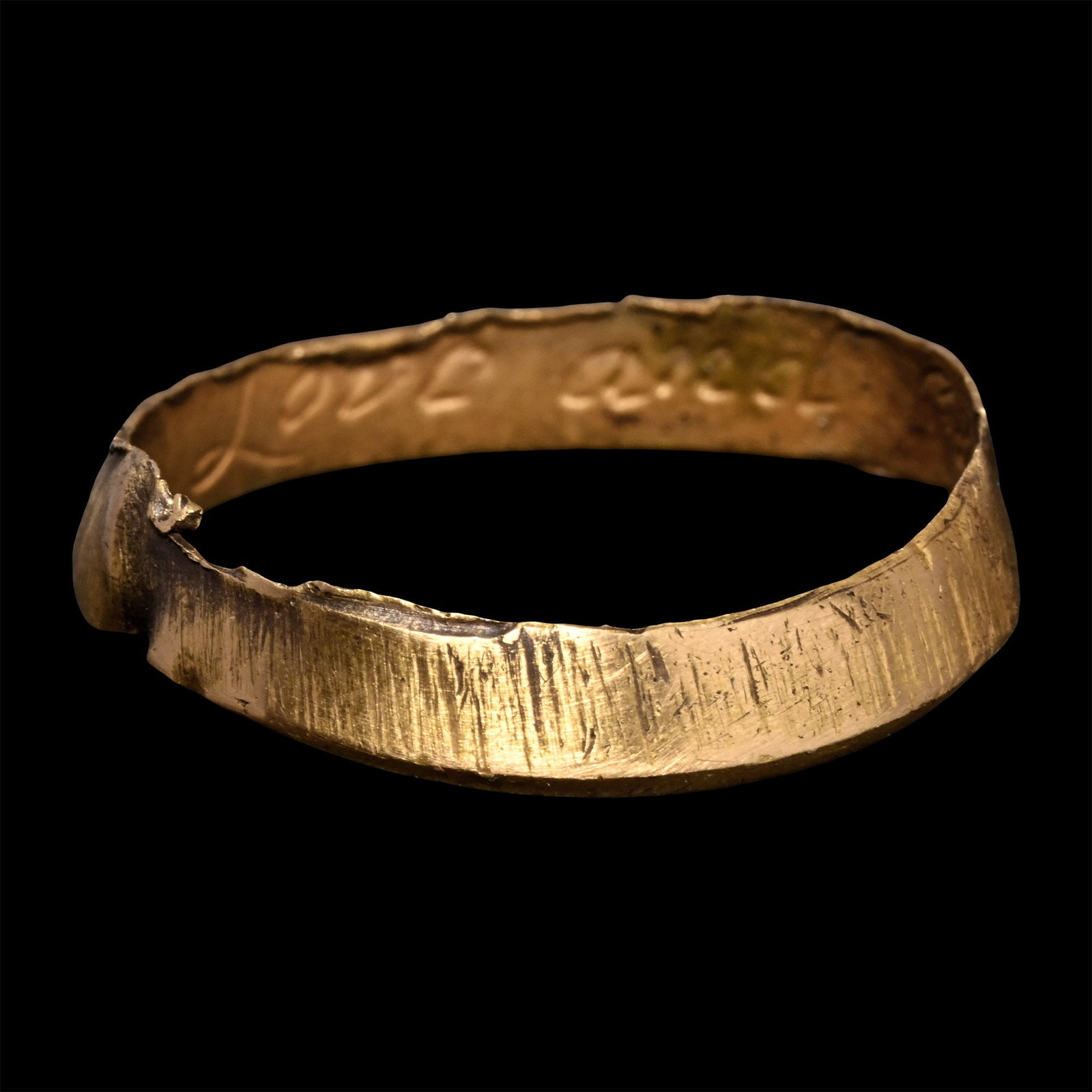 Post Medieval 'Love and Live Happily' Gold Posy Ring: 18th century A.D. Inscribed to the inner face in an italic hand 'Love and [l]ive happily'. 2.17 grams, 19.85 mm overall, 17.49 mm internal diameter (approximate size British N 1/2, USA 6 3/4, Europe 1