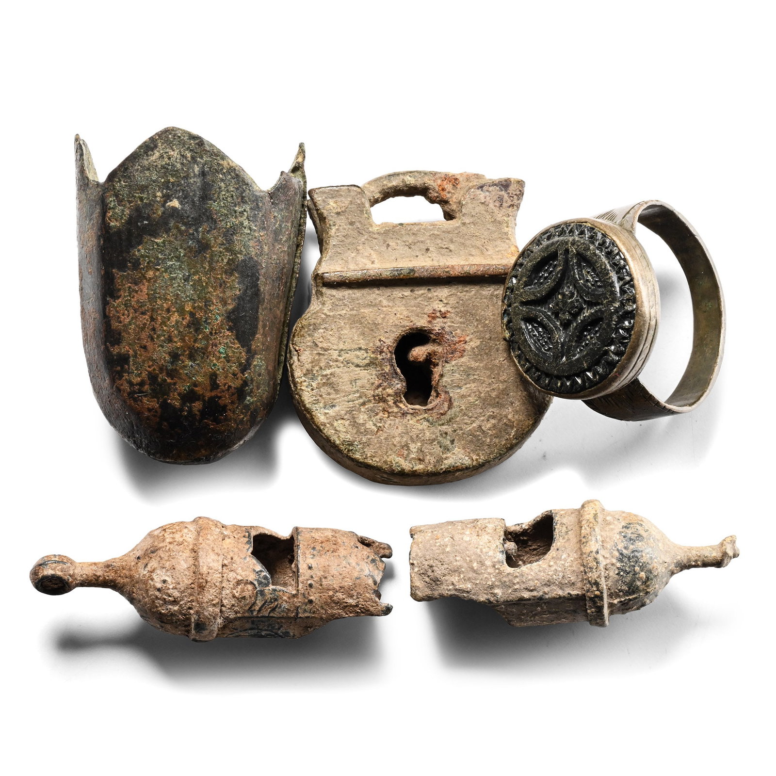 Post Medieval Artefact Group: 16th-19th century A.D. Comprising: two whistles, a padlock, a finial, and a ring with a double cross motif. 64.3 grams total, 24-38 mm (1 - 1 1/2 in.). [5] Ex German art market, 2000s. Acquired from a