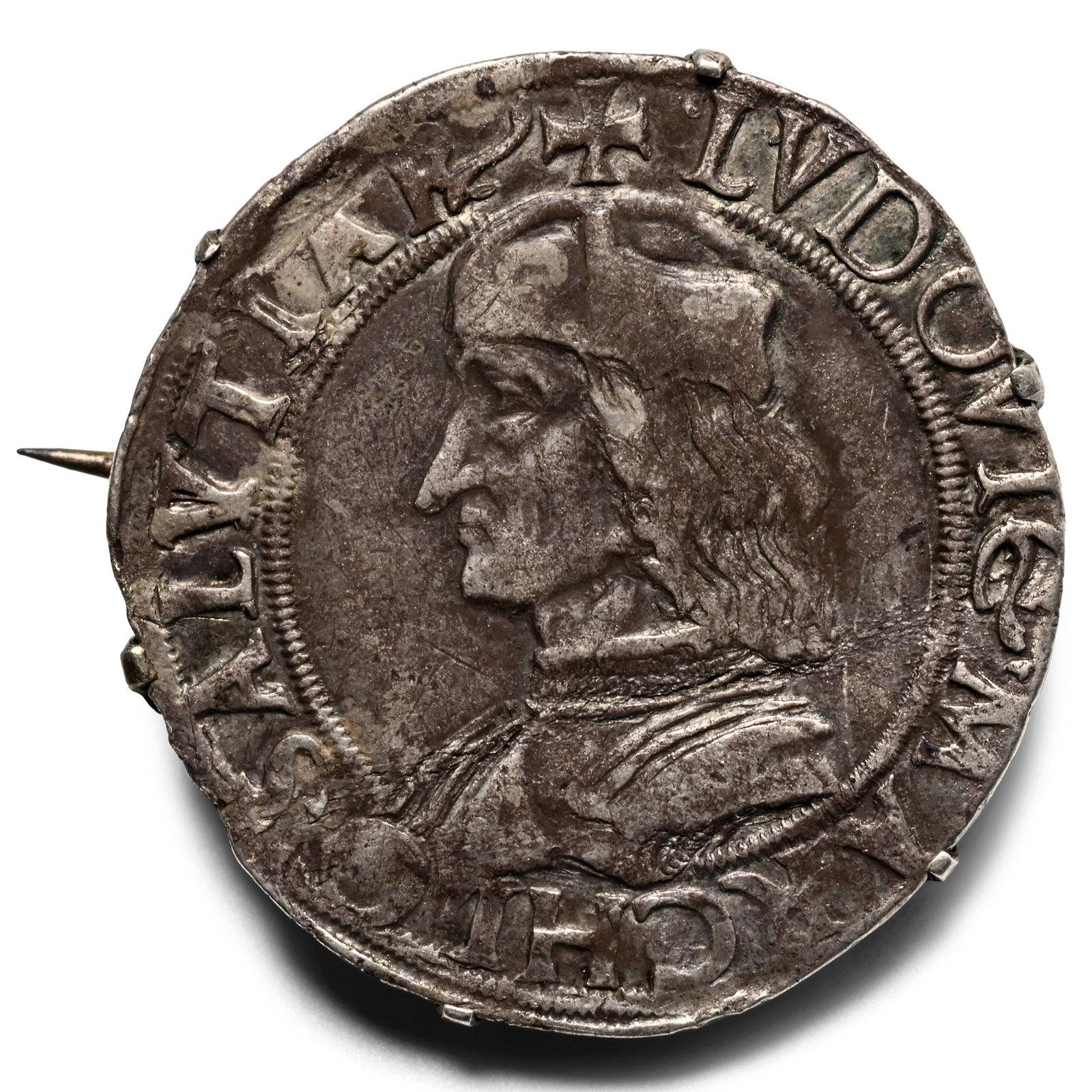 Louis XIV Silver Jetton in Later Silver Brooch: 1643-1715 A.D. The obverse showing the profile bust of the king facing left with an inscription surrounding, and a king on horseback on the reverse; set in a later brooch frame. 6.05 grams, 30 mm (1 1