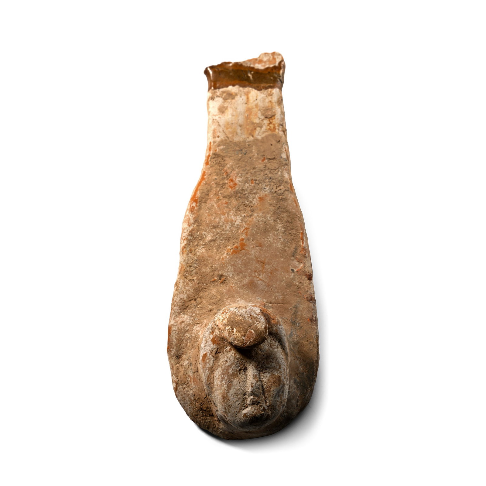 Chinese Tang Terracotta Hanging Bust: Tang Dynasty, 618-907 A.D. or later. Formed as a shoe-shaped plaque with a raised head at one end. 220 grams, 17.5 cm (6 7/8 in.). [No Reserve] From a deceased estate of a gentleman collector from the