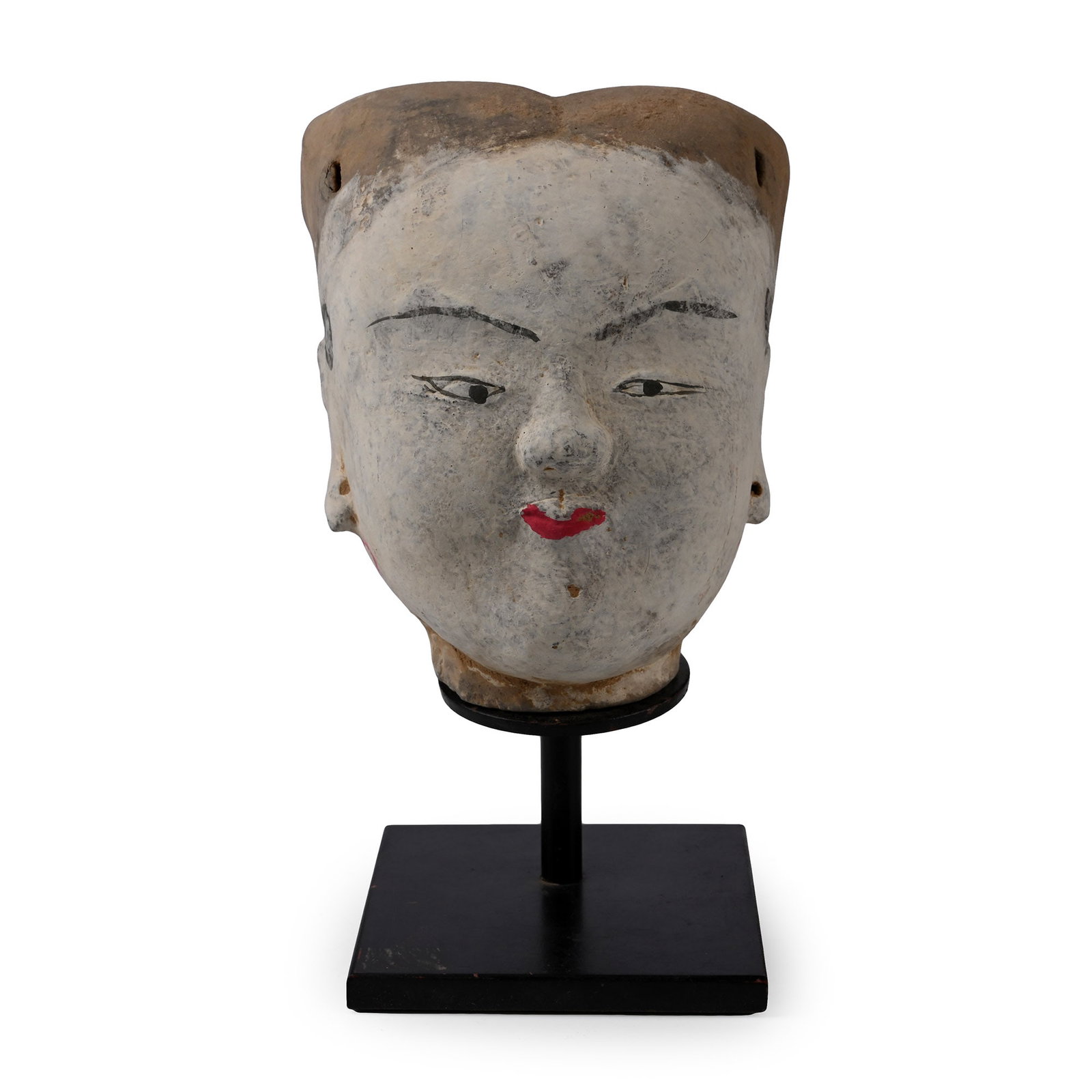Chinese Han Terracotta Female Head: Han Dynasty, 206 B.C.-220 A.D. or later. Hollow-form head with characteristic painted facial detailing, including small red lips, wearing a headdress with two bead drops resting on her temples and two
