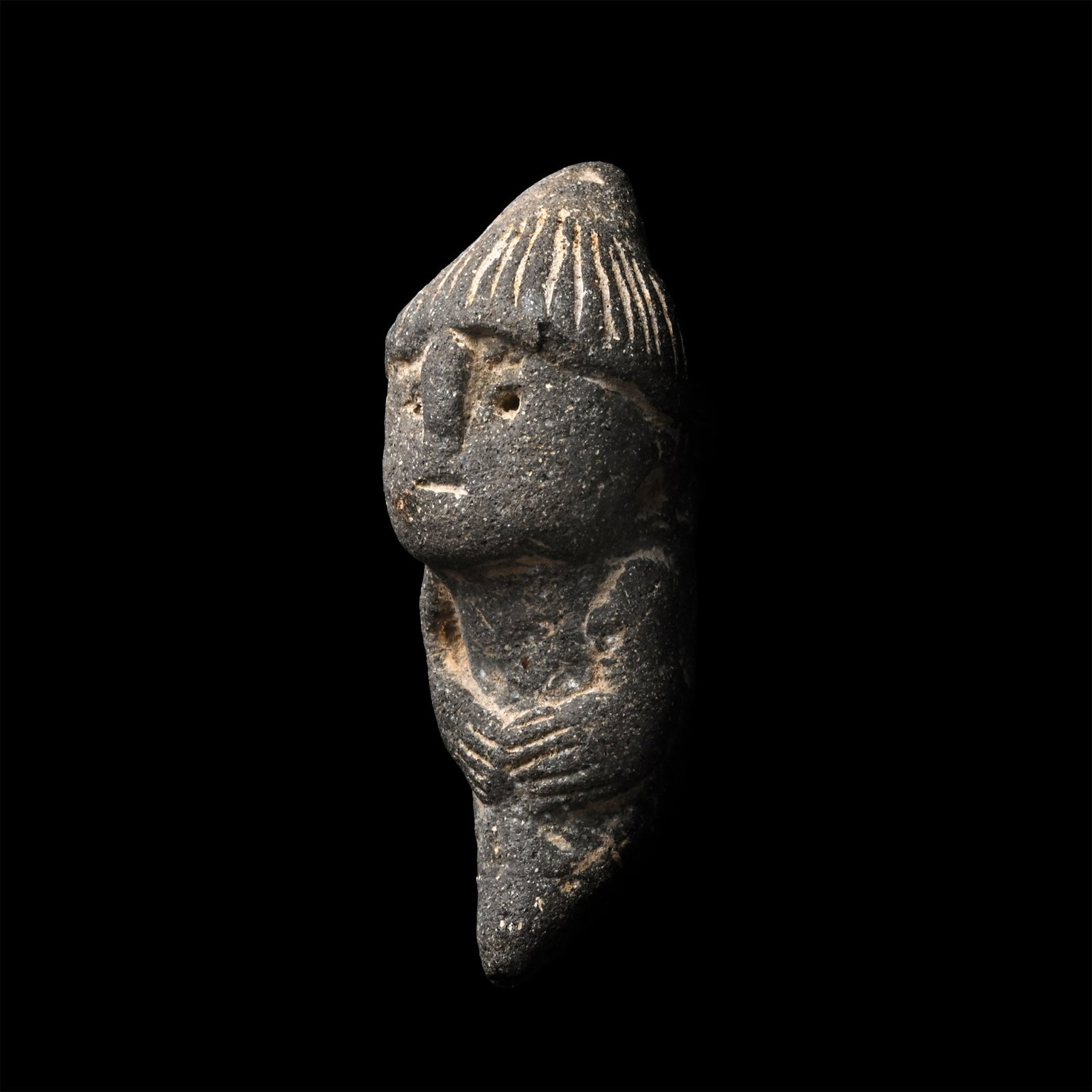Pre-Columbian Anthropomorphic Terracotta Figure: Regional Development Period, 300 B.C.-600 A.D. Depicting a highly stylised anthropomorphic character standing frontally, with a disproportionately large head, schematic facial features, and arms cross