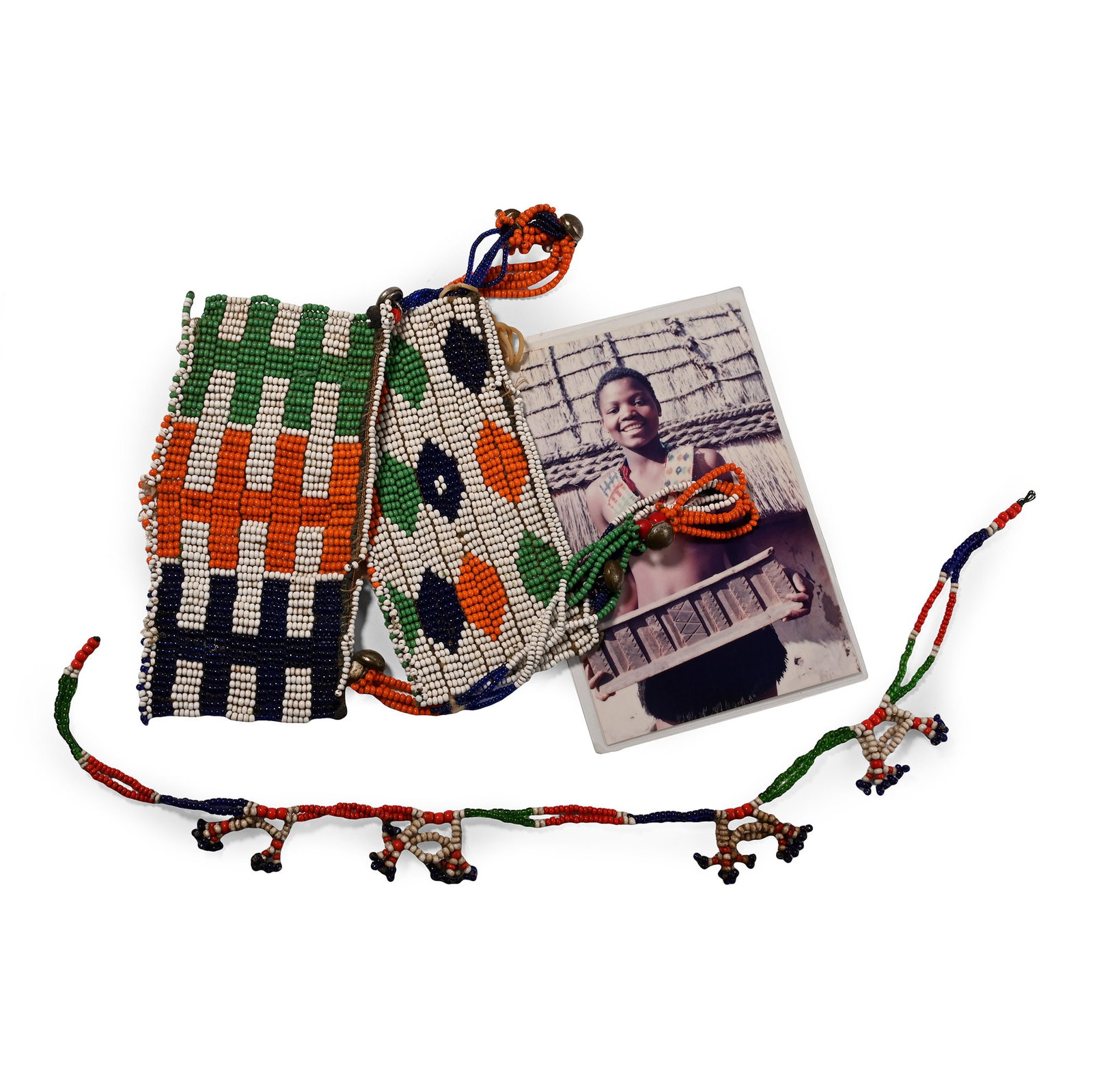 Zulu Woman's Beaded 'Isijumba' and 'Izilimi' Neckpieces and Photograph of Ms Themba Xulu, a: 20th century A.D. Comprising two beaded neck decorations made from vibrant polychrome beads. 184 grams total, neckpieces: 68 cm long (26 3/4 in.). [No Reserve] Collected September 2003 in the mountain