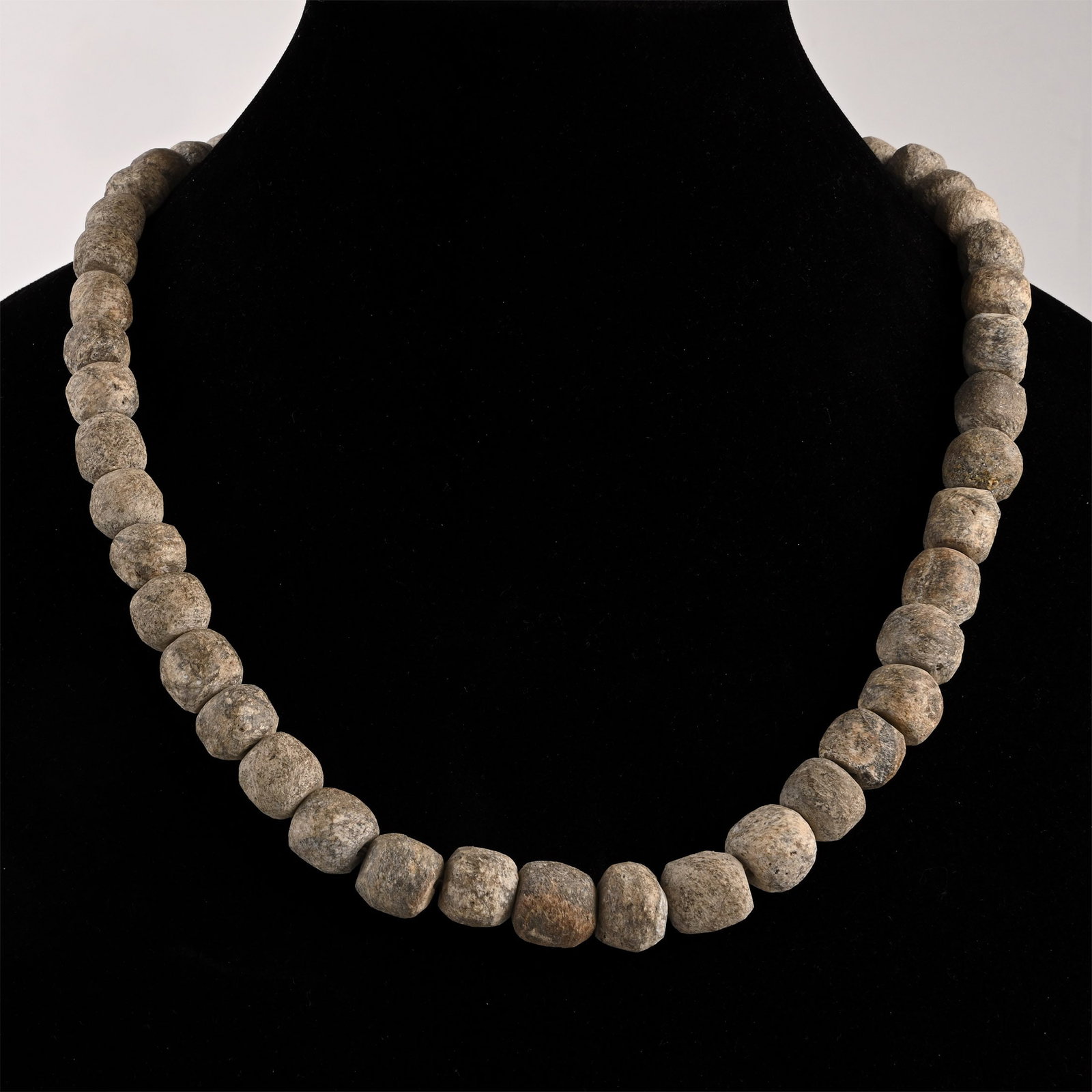 Woolly Mammoth Bone Bead Necklace String: Pleistocene Epoch, 2.6 million-11,700 years B.P. Restrung, using recently polished oblate Mammuthus primigenius bone beads. See Guide to the Elephants (Recent and Fossil) in the British Museum (Natura