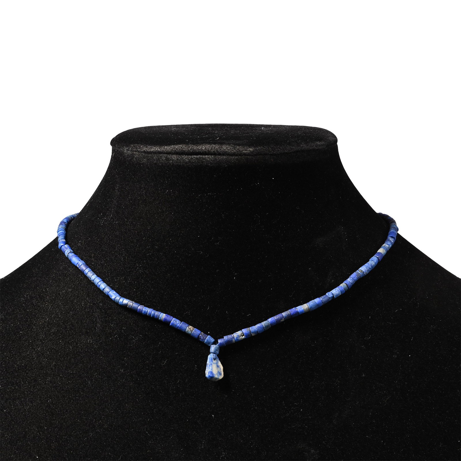 Bactrian Style Lapis Lazuli Bead Necklace String: Composed of short cylindrical beads with a teardrop-shaped pendant, restrung. 7.1 grams, 32.5 cm (12 7/8 in.). [No Reserve] Acquired in the 1990s-early 2000s. Ex London, UK, collection. TimeLine Aucti
