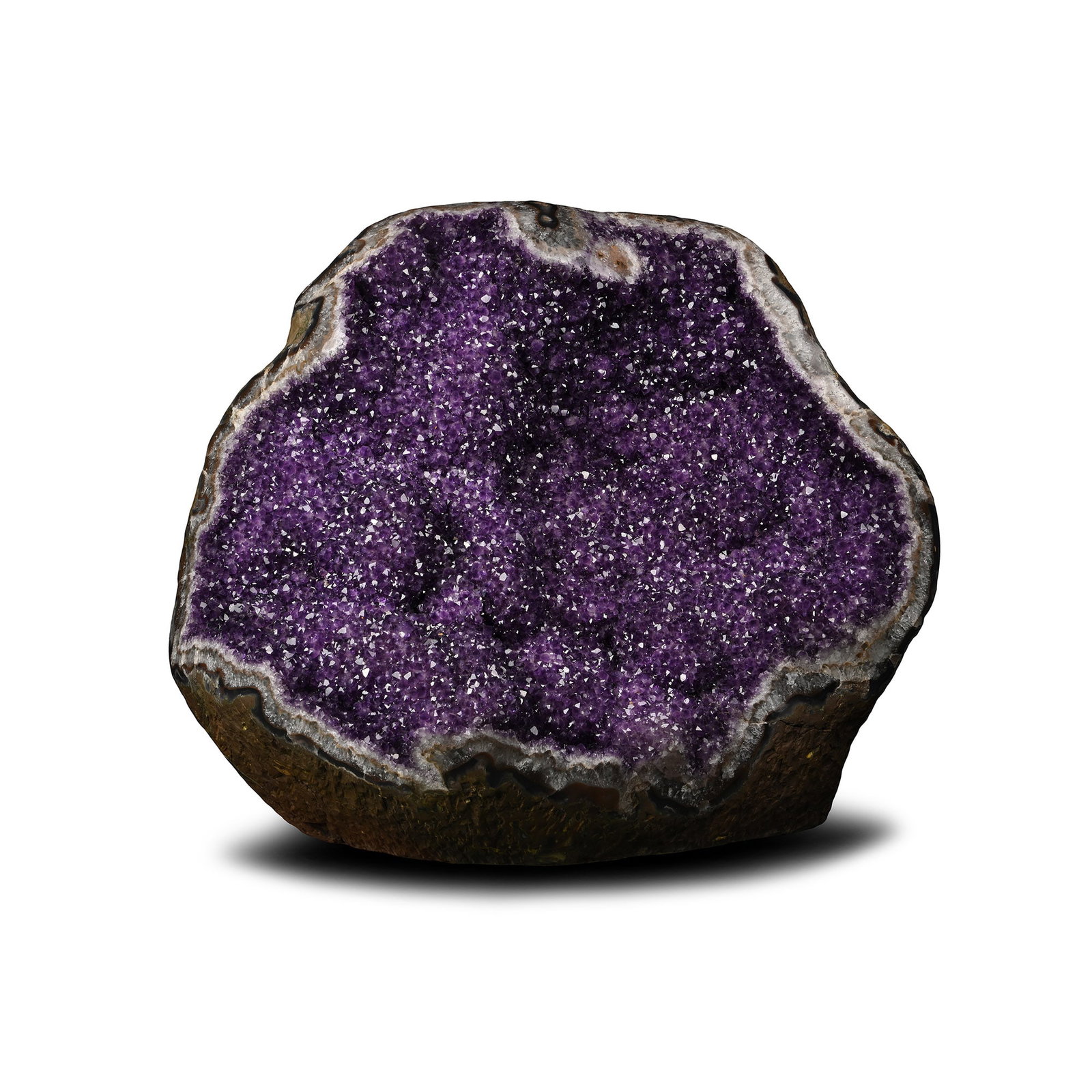 Massive Deep Purple Amethyst Crystal Geode Display: Circa 140-120 million years B.P. A large freestanding geode display with polished edges, the interior lined with rich, deep purple amethyst crystals. 177 kg, 63 x 72 x 37 cm (24 3/4 x 28 1/4 x 14 1/2 