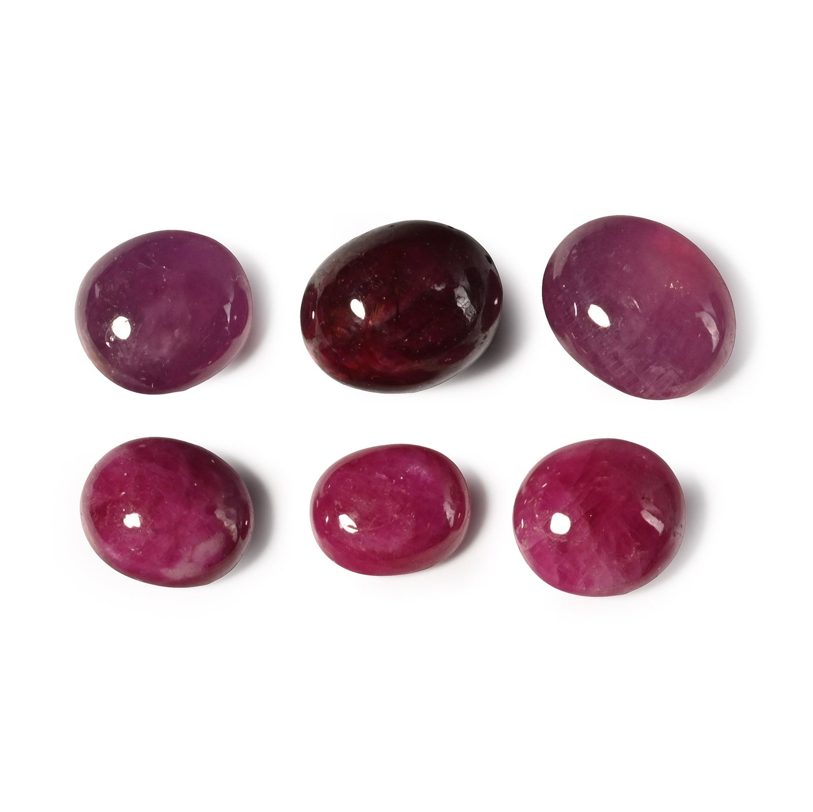 Collection of Cabochon Rubies: Comprising six polished cabochons, some lead glass-filled. 5.15 grams total, 8-11 mm (1/8 - 1/2 in.). [6] Private collection, London, UK. TimeLine Auctions follows a rigorous vetting process to ensure