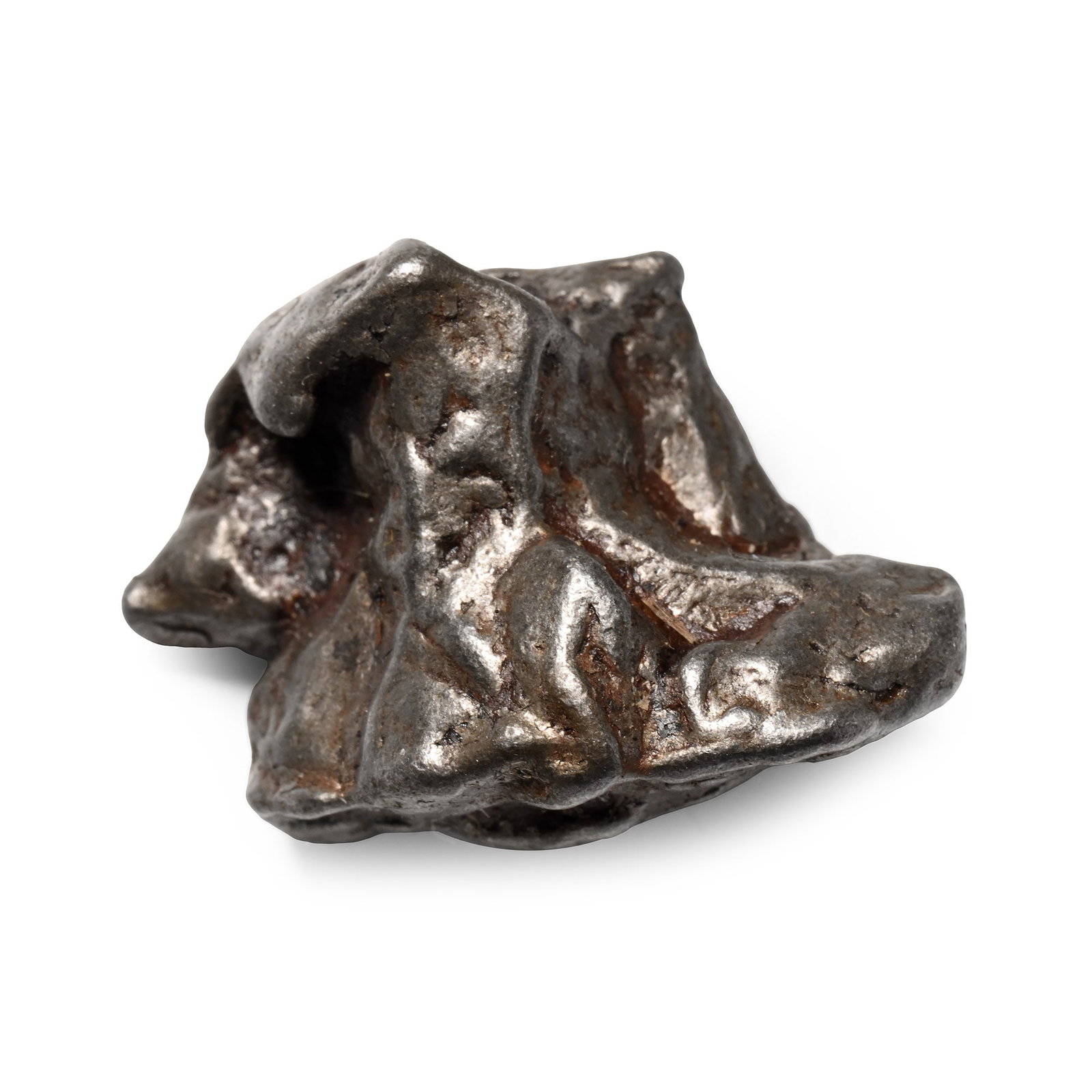 Sikhote Alin Meteorite: Fell 12th February 1947 A.D. A coarse octahedrite class IIB iron meteorite; cleaned. 17.86 grams, 26 mm (1 in.). [No Reserve] From a Lincolnshire, UK, collection. Sikhote-Alin is an iron meteorite tha