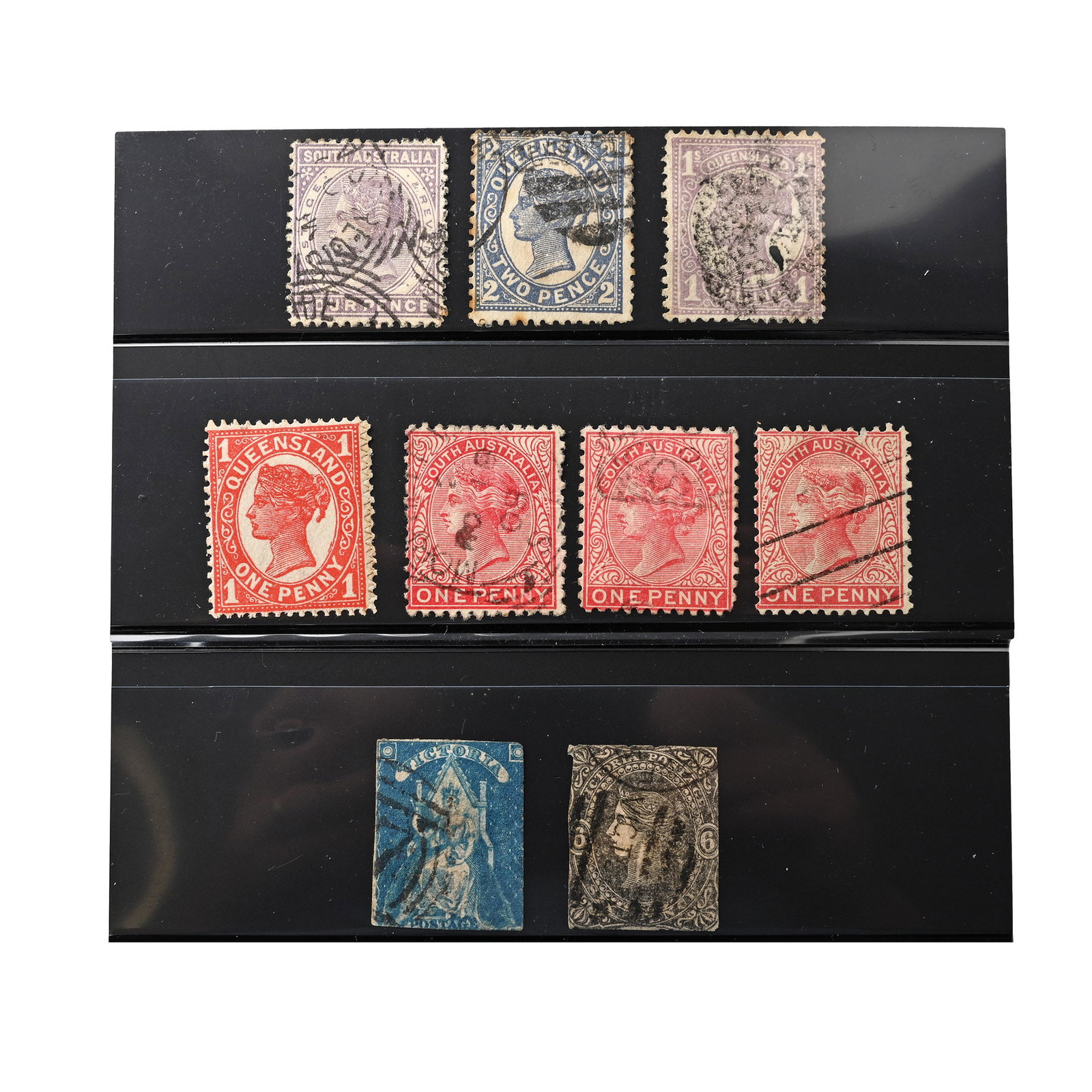 Victorian Queensland and Victoria Australian Stamps: 19th century A.D. Queensland, Australia, Queen Victoria (QV): 7 x perforated stamps, including a mint hinged one penny red; and two stamps from Victoria. 13 grams total, card: 12 x 8.5 cm (4 3/4 x 3 1