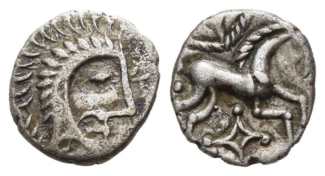 Celtic Britannia. Iceni AR Unit.: Circa AD 20-43. Norfolk God Moustache type. Male head to right, with short spiky hair and boarskin headdress./ Horse to right, with cabled mane, cabled pelta above, kite shape below. ABC 1567; Van Ars