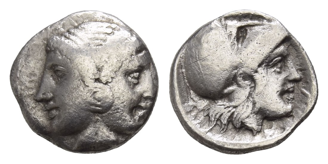 Mysia, Lampsakos AR Diobol.: Circa 350-300 BC. Janiform female heads, with central earring / Inscription around, helmeted head of Athena to right. Cf. SNG Arikant?rk 622-6. 1.25gr, 11mm, 11h. Near Very Fine. Acquired on UK art ma