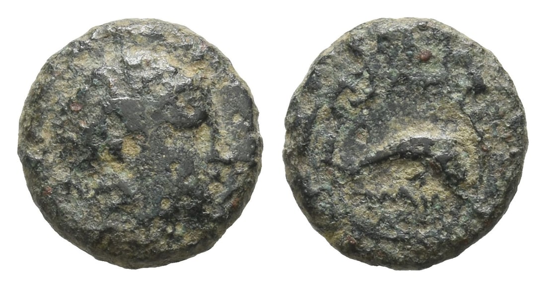 Ionia, Naulochos AE 11mm.: Circa 350-340 BC. Helmeted head of Athena to right / NAY, dolphin to right within circular maeander pattern. SNG Kayhan 1421. 1.21gr, 11mm, 12h. Near Very Fine. Very rare city. Acquired on the Europea