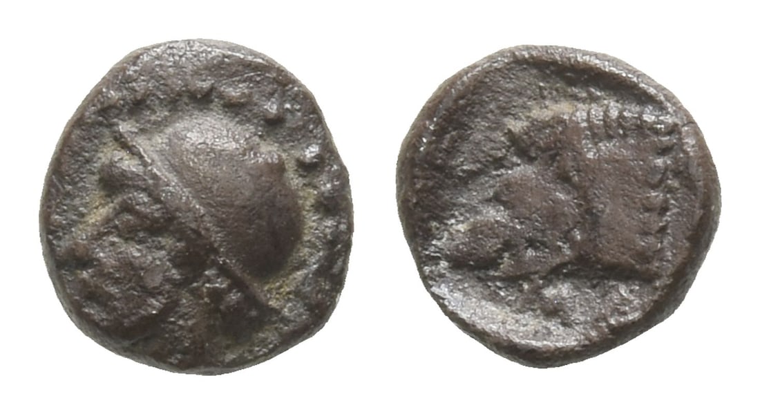 Cilicia, Mallos AR Hemiobol.: Circa 440-390 BC. Bearded head of Bellerophon to left, wearing cap or helmet; all within dotted border / MA, head of boar to left. Unpublished in the standard references; for another example cf. Nomos