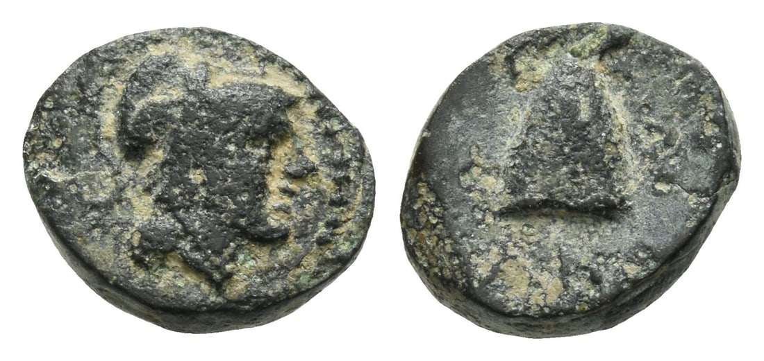 Seleukid Empire, Antiochos I Soter AE 12mm.: 281-261 BC. Tarsos mint. Head of Athena to right, wearing Corinthian helmet / BA AN, laureate pileus. SC 334; HGC 9, 217 (R3). 1.53gr, 12mm, 1h. Near Very Fine. Extremely rare; no other examples on Co