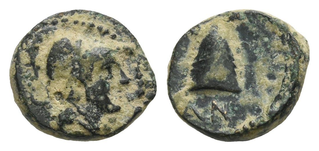 Seleukid Empire, Antiochos I Soter AE 12mm.: 281-261 BC. Tarsos mint. Head of Athena to right, wearing Corinthian helmet / BA AN, laureate pileus. SC 334; HGC 9, 217 (R3). 1.34gr, 12mm, 2h. Near Very Fine. Extremely rare; no other examples on Co
