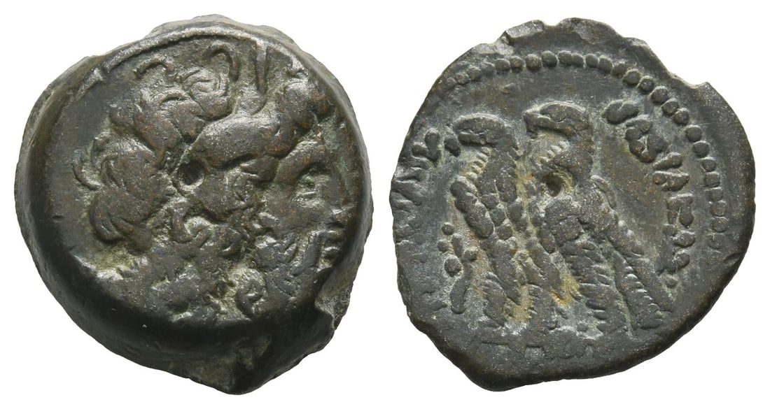 Ptolemaic Kingdom of Egypt, Ptolemy IX to Ptolemy XII AE 20mm.: 116-51 BC. Alexandria mint. Series 9. Diademed head of Zeus-Ammon to right / ?????????? ????????, two eagles with their wings closed standing to left on thunderbolt; cornucopia to left. Svoronos 1426 