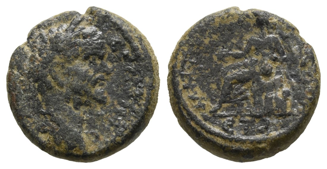 Septimius Severus AE 18mm of Caesarea, Cappadocia.: AD 193-211. Laureate head to to right / Male figure seated to left on Mount Argaeus, holding branch in his right hand and resting his left on globe. 5.55gr, 18mm, 12h. Near Very Fine. Acquired on the 