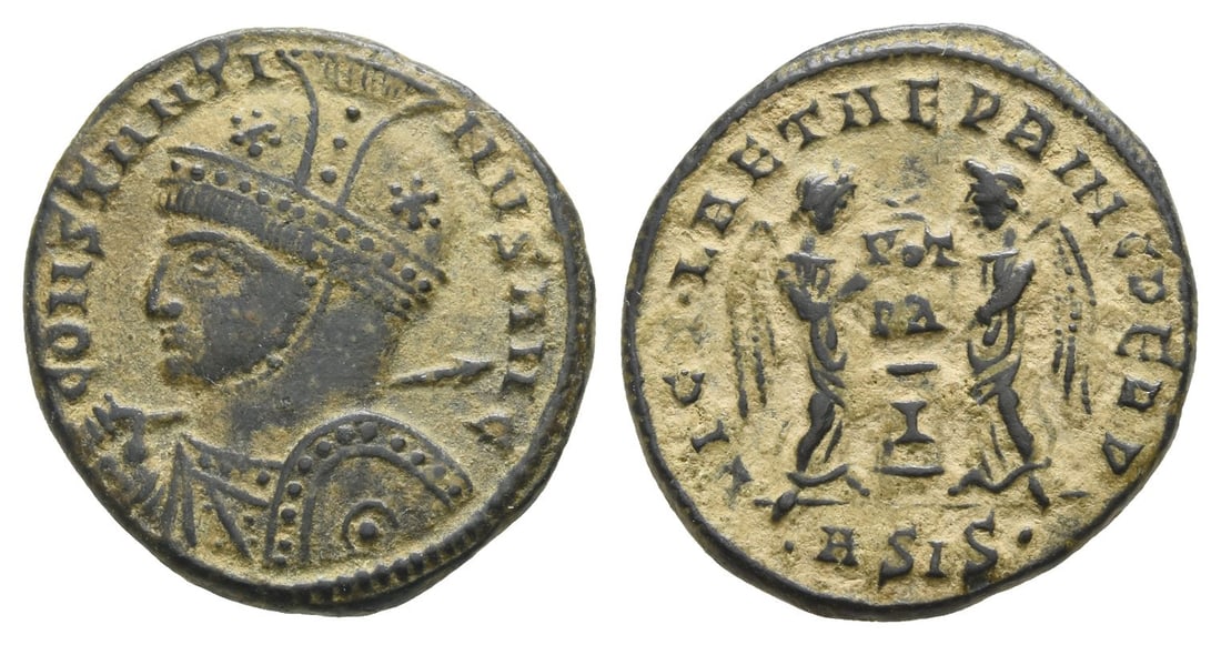 Constantine I BI Nummus.: AD 319. Siscia mint. 1st officina. CONSTANTINVS AVG, high-crested helmeted and cuirassed bust to left, holding shield and spear across shoulder / VICT?LAETAE PRINC PERP, two Victories holding shield i