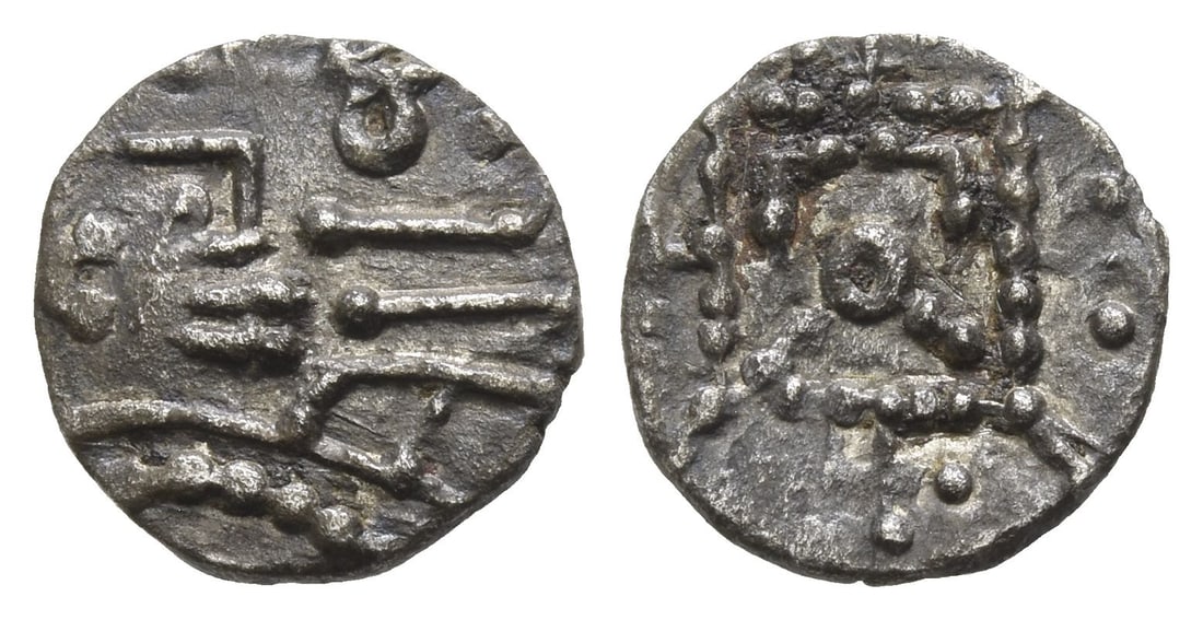 Anglo-Saxon. Secondary Sceattas AR Sceat.: Circa 730-750. Mint in East Anglia (Ipswich). Series R8. Radiate bust to right with C-shaped ear; [to left, ? flanked by annulets]; annulet and runic EA to right / 'Standard' with central annulet, che