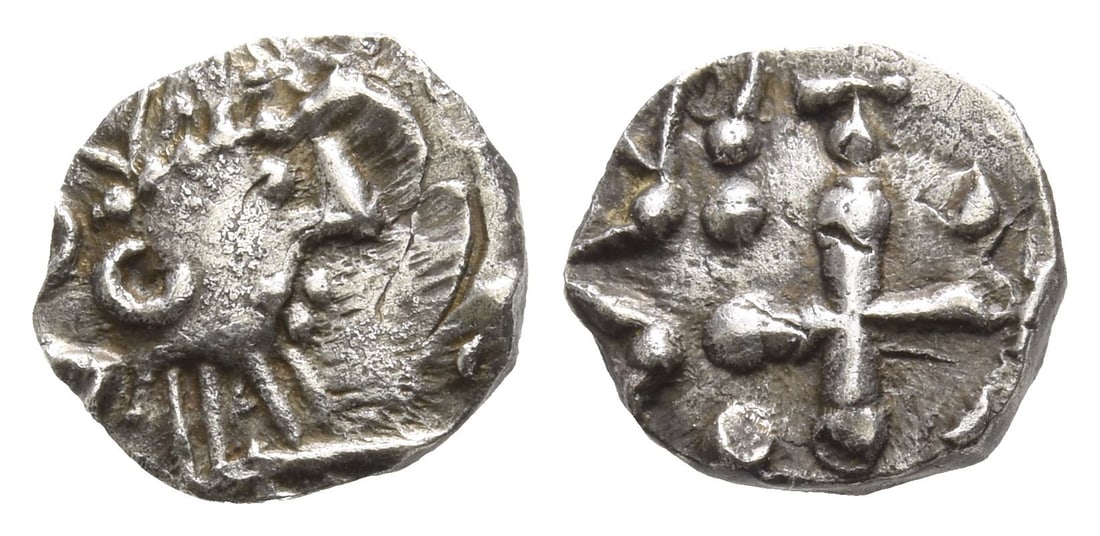 Anglo-Saxon. Continental Sceattas AR Sceat.: Circa 690-710/5. Mint in northern Frisia. Struck under Radbod, King of Frisia. Series D, type 2c.. Crude crowned bust to right / Cross pomm?e, pellets in angles; cross above, blundered legend around. 