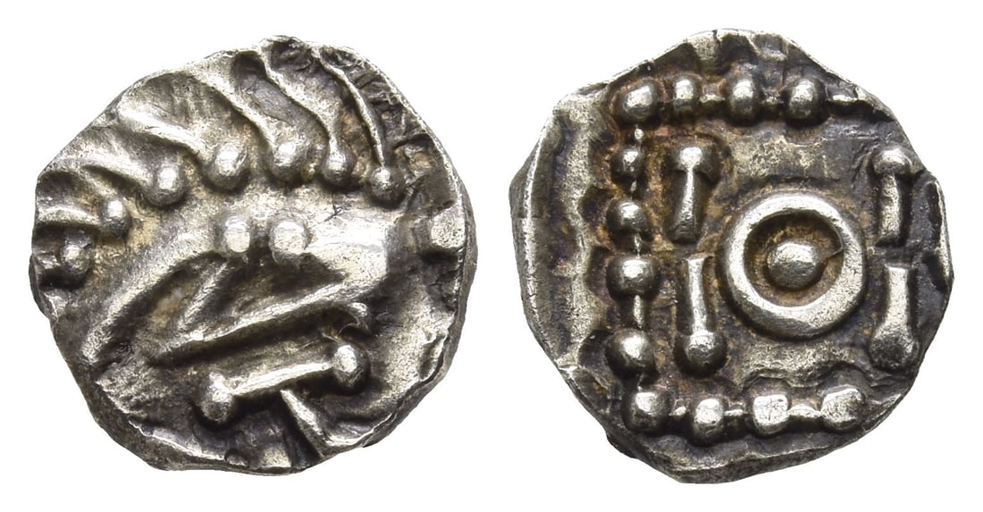 Anglo-Saxon. Continental Sceattas AR Sceat.: Circa 690-715/20. Mint in southern Frisia. Series E. 'Porcupine' with legs to right; [Runic XAZO(?) below] / Standard with central annulet, four lines around. North 45; SCBC 790D. 1.27gr, 12mm, 4h. Ve