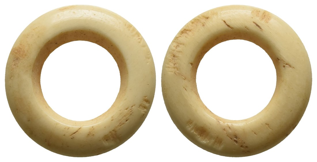 Minor Asia and Levante Bone Weight of Uncertain Standard.: Circa 750-300 BC. Bone ring with wide hole and old inked tag: 'Hara 19/10/71 / from Hebron'. For a similar example see British Museum 1969,0401.120. 2.07gr, 23mm, 12h. Condition as seen. Found Hebron 