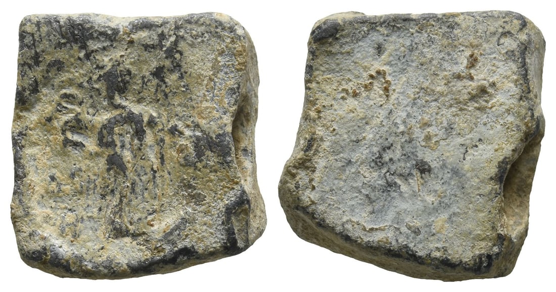 Late Roman PB Seal.: Circa 4th-6th century AD. Standing figure to left, holding uncertain object; illegible inscription around / Blank. 14.76gr, 19mm, 12h. [No Reserve] Fine. Acquired on the UK art market circa 2004. From