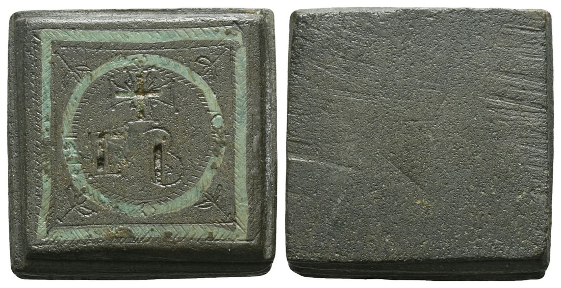 Byzantine Square AE Commercial Weight of 2 Unciae.: Circa 4th-6th century AD. Engraved in outline (and inlaid with silver) cross above ? B; all within circular wreath and square wreath with flowers in angles. 53.61gr, 27mm. Condition as seen. Ex German